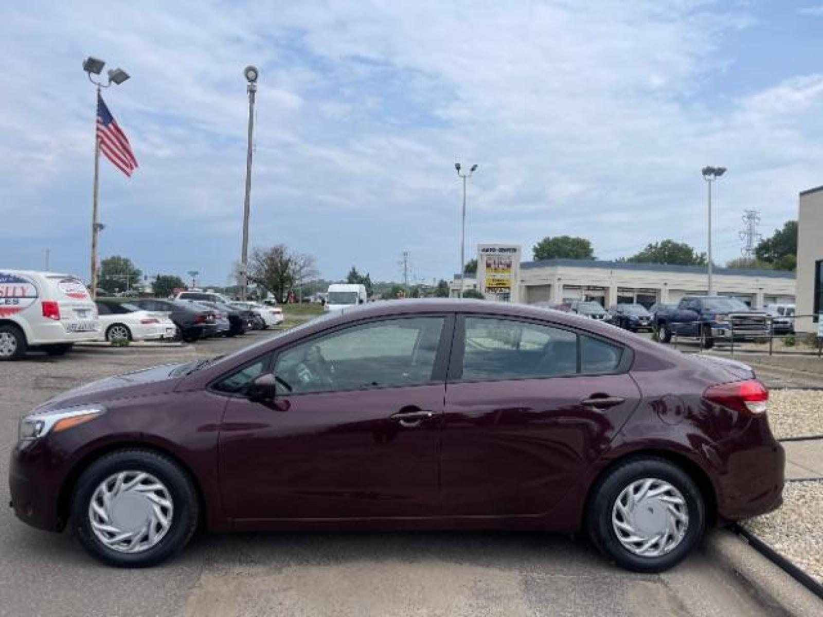 2017 Garnet Red /Black, cloth Kia Forte LX 6A (3KPFL4A76HE) with an 2.0L L4 DOHC 16V engine, 6-Speed Automatic transmission, located at 3301 W Hwy 13, Burnsville, MN, 55337, (952) 460-3200, 44.775333, -93.320808 - Photo #3