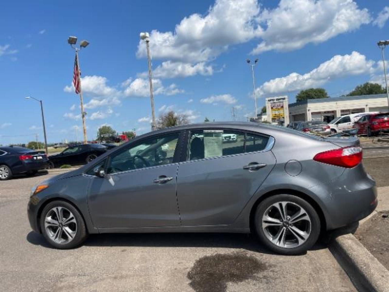 2016 Graphite Steel Kia Forte EX (KNAFX4A84G5) with an 2.0L L4 DOHC 16V engine, 6-Speed Automatic transmission, located at 3301 W Hwy 13, Burnsville, MN, 55337, (952) 460-3200, 44.775333, -93.320808 - Photo #2