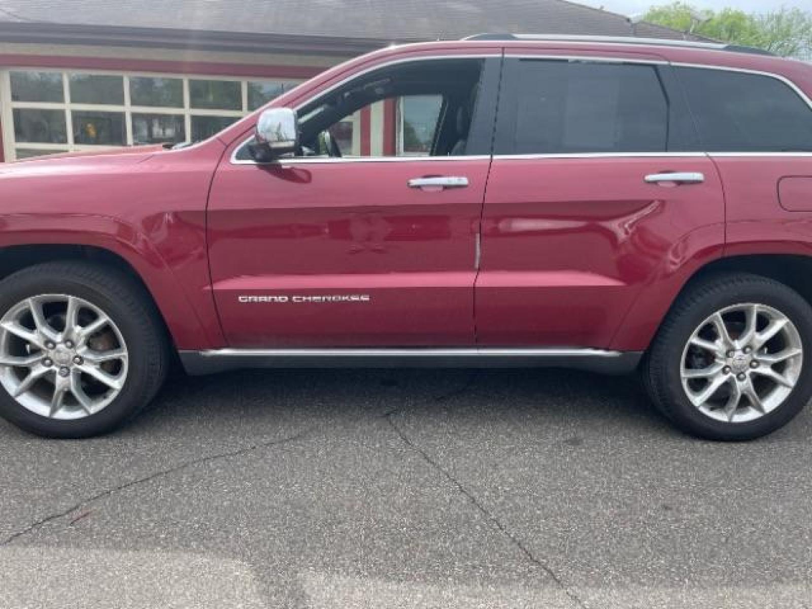 2014 Dp Cherry Red Crystal PC /Brown Jeep Grand Cherokee Summit 4WD (1C4RJFJG7EC) with an 3.6L V6 DOHC 24V engine, 5-Speed Automatic transmission, located at 834 West 7th Street, St. Paul, MN, 55102, (651) 797-6393, 44.930954, -93.121559 - Photo #1
