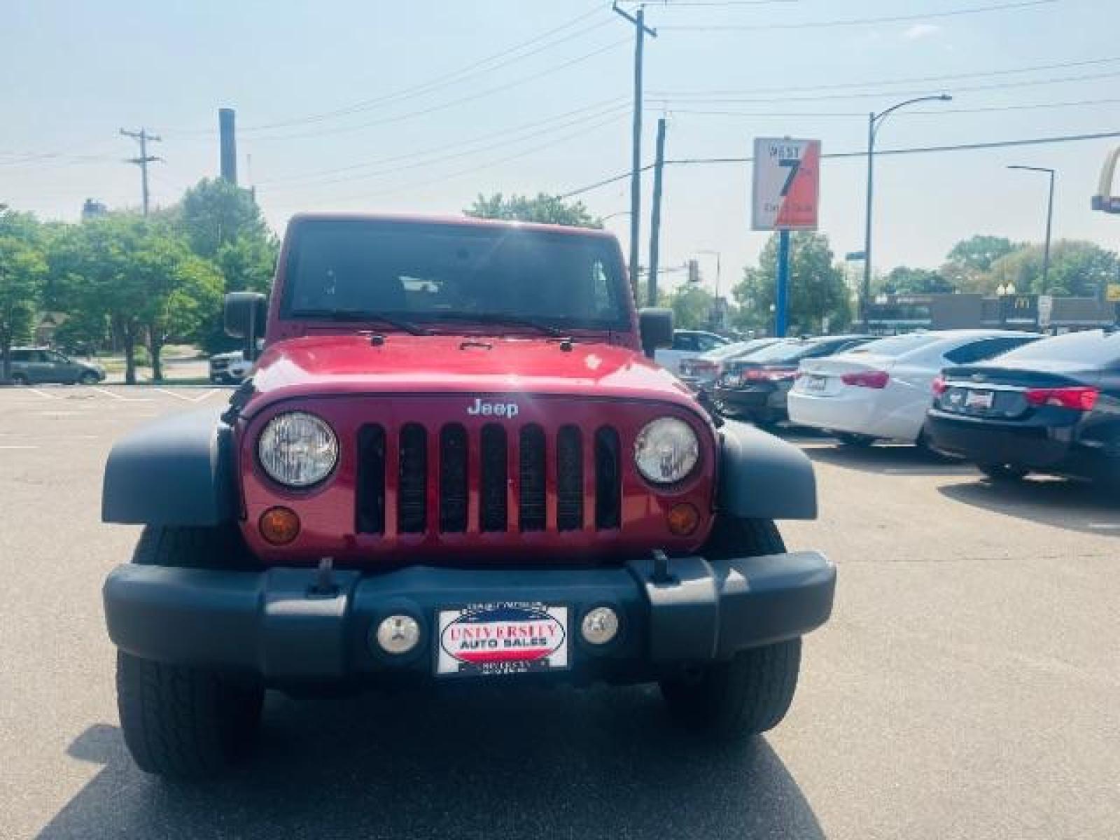 2011 Deep Cherry Red Crys Jeep Wrangler Unlimited Sport 4WD (1J4BA3H15BL) with an 3.8L V6 OHV 12V engine, located at 834 West 7th Street, St. Paul, MN, 55102, (651) 797-6393, 44.930954, -93.121559 - Photo #0