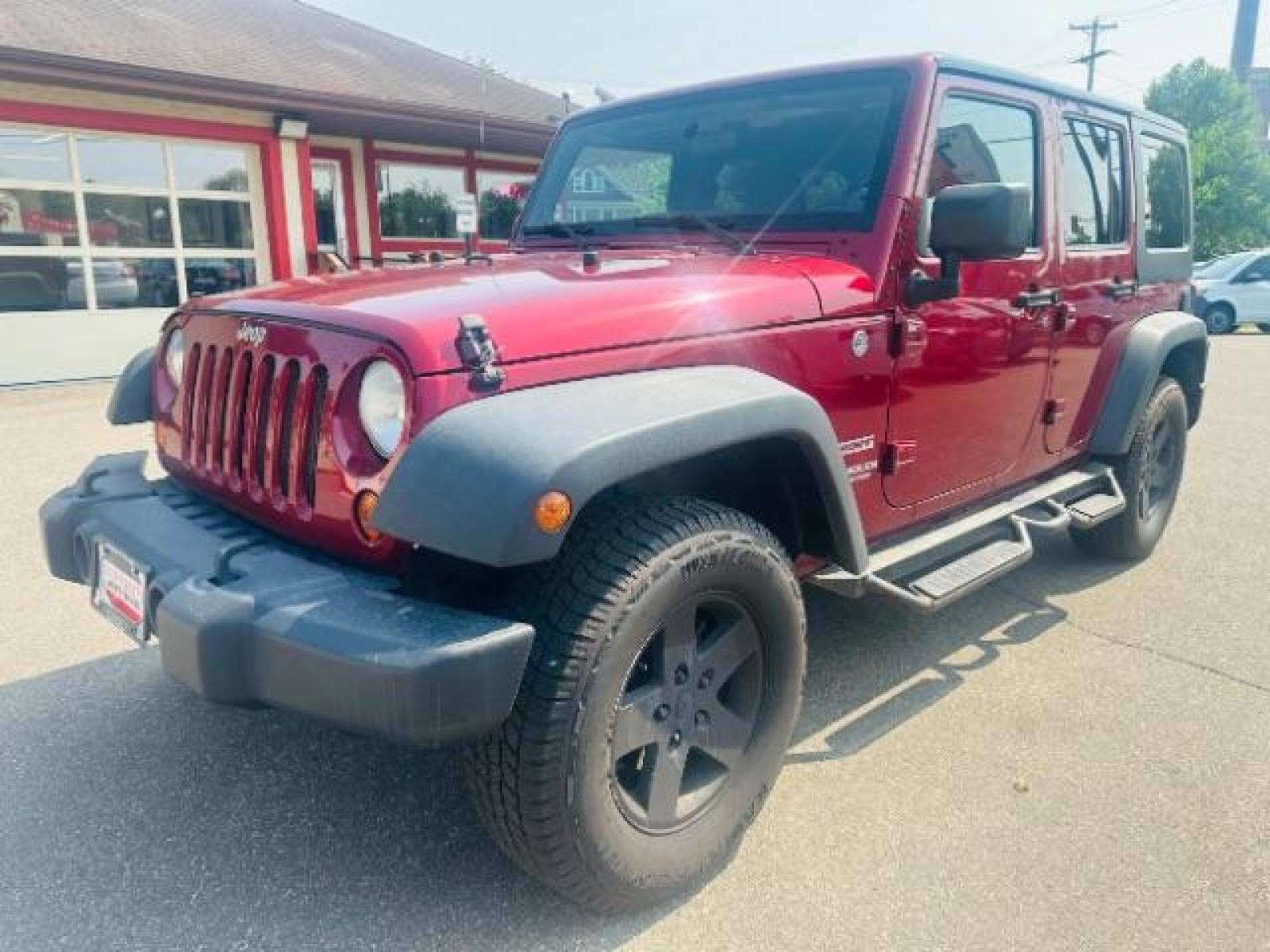 2011 Deep Cherry Red Crys Jeep Wrangler Unlimited Sport 4WD (1J4BA3H15BL) with an 3.8L V6 OHV 12V engine, located at 834 West 7th Street, St. Paul, MN, 55102, (651) 797-6393, 44.930954, -93.121559 - Photo #1