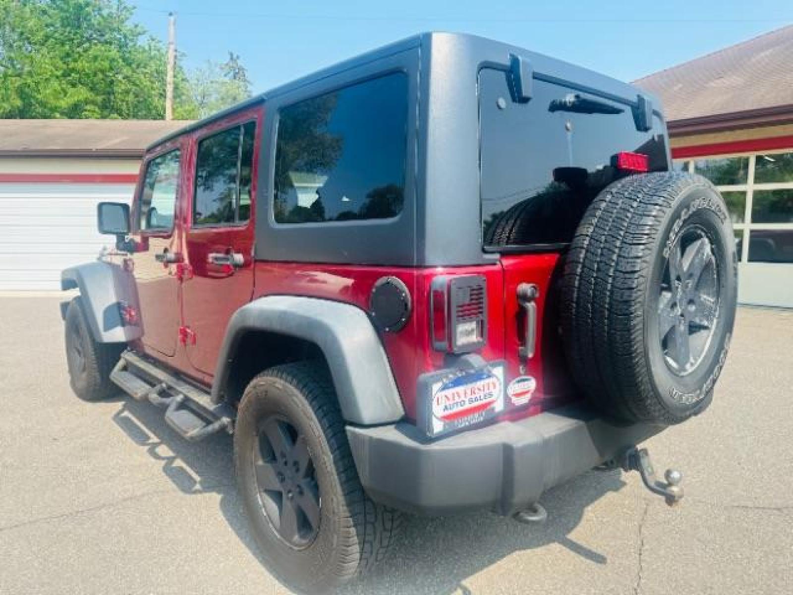 2011 Deep Cherry Red Crys Jeep Wrangler Unlimited Sport 4WD (1J4BA3H15BL) with an 3.8L V6 OHV 12V engine, located at 834 West 7th Street, St. Paul, MN, 55102, (651) 797-6393, 44.930954, -93.121559 - Photo #2