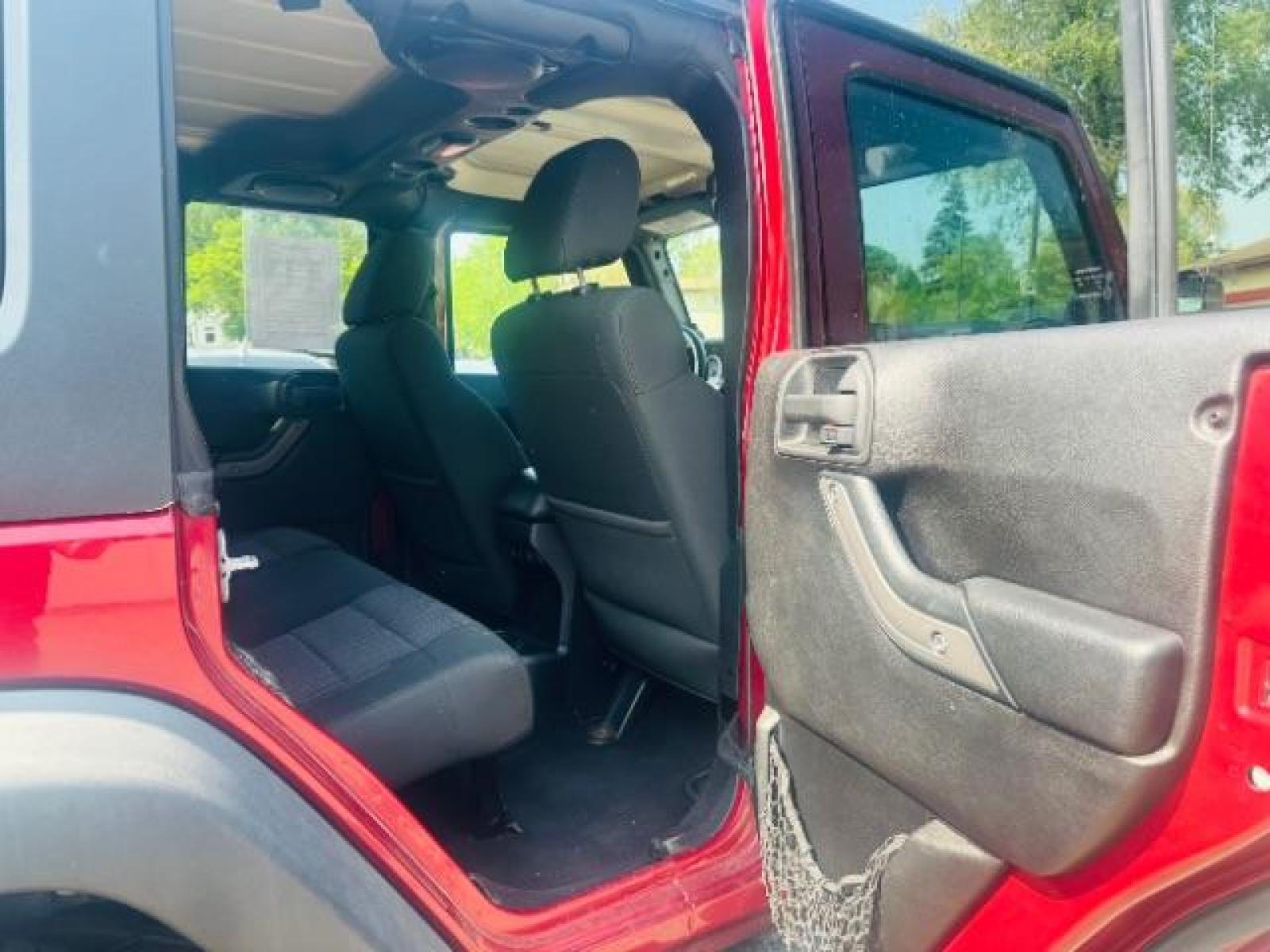 2011 Deep Cherry Red Crys Jeep Wrangler Unlimited Sport 4WD (1J4BA3H15BL) with an 3.8L V6 OHV 12V engine, located at 834 West 7th Street, St. Paul, MN, 55102, (651) 797-6393, 44.930954, -93.121559 - Photo #7