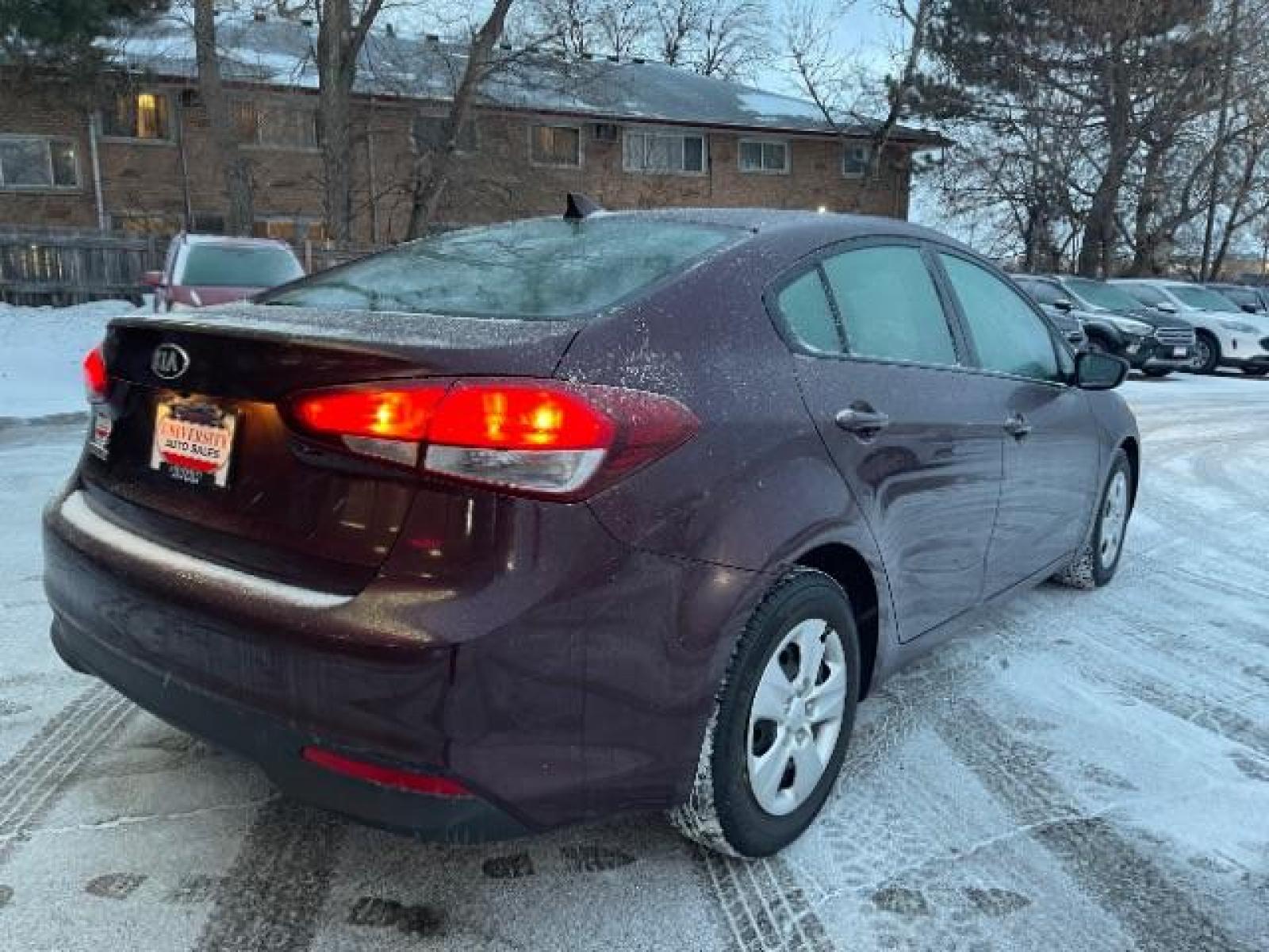 2017 Garnet Red Kia Forte LX 6A (3KPFL4A72HE) with an 2.0L L4 DOHC 16V engine, 6-Speed Automatic transmission, located at 745 S Robert St, St. Paul, MN, 55107, (651) 222-2991, 44.923389, -93.081215 - Photo #4