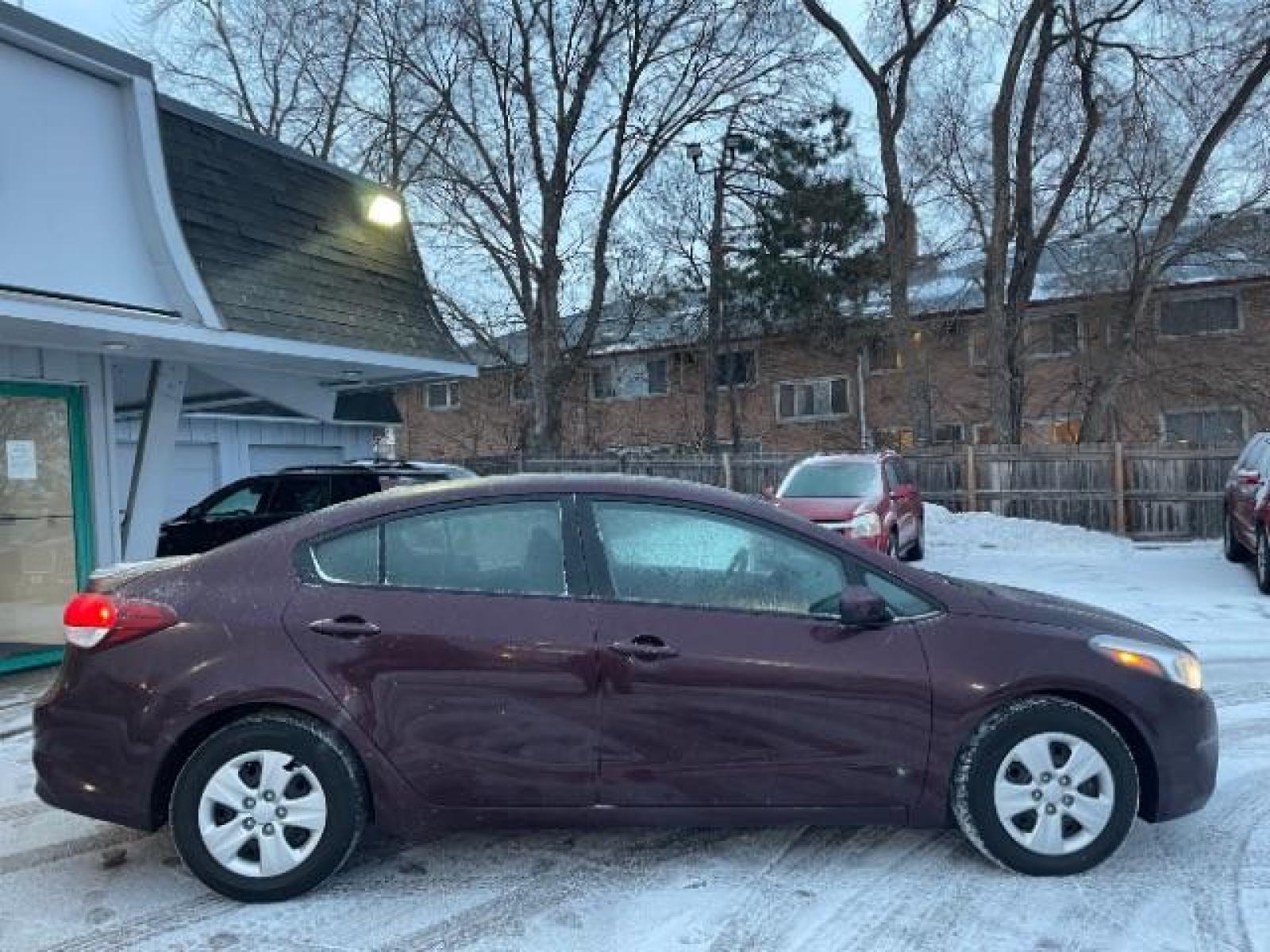 2017 Garnet Red Kia Forte LX 6A (3KPFL4A72HE) with an 2.0L L4 DOHC 16V engine, 6-Speed Automatic transmission, located at 745 S Robert St, St. Paul, MN, 55107, (651) 222-2991, 44.923389, -93.081215 - Photo #5