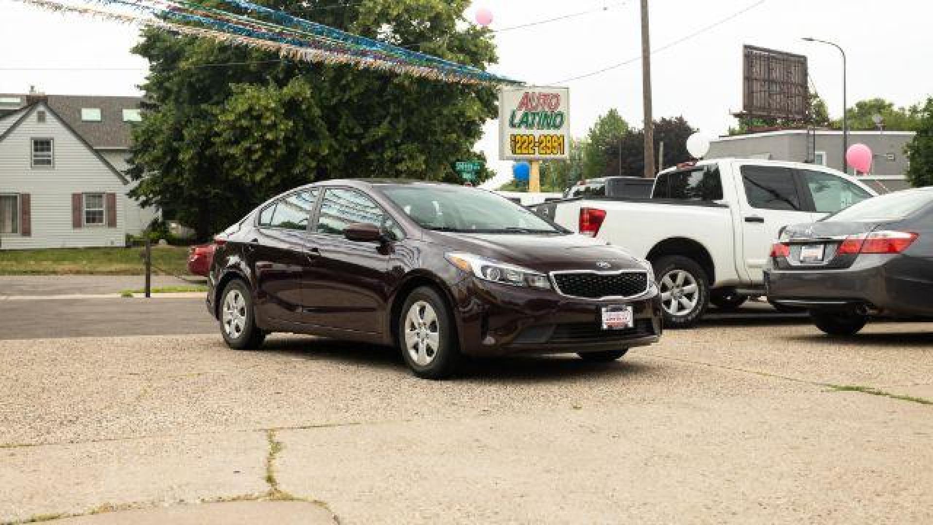 2017 Garnet Red Kia Forte LX 6A (3KPFL4A72HE) with an 2.0L L4 DOHC 16V engine, 6-Speed Automatic transmission, located at 745 S Robert St, St. Paul, MN, 55107, (651) 222-2991, 44.923389, -93.081215 - Photo#0