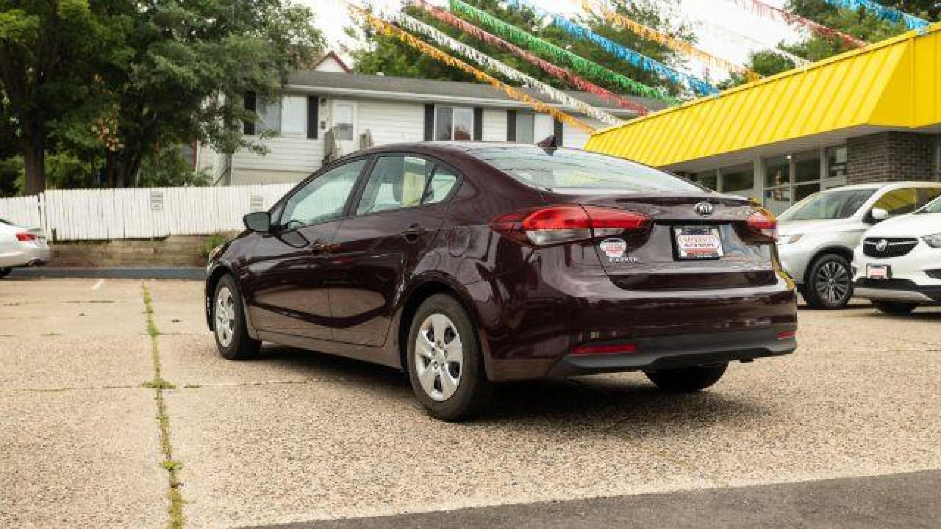 2017 Garnet Red Kia Forte LX 6A (3KPFL4A72HE) with an 2.0L L4 DOHC 16V engine, 6-Speed Automatic transmission, located at 745 S Robert St, St. Paul, MN, 55107, (651) 222-2991, 44.923389, -93.081215 - Photo#1