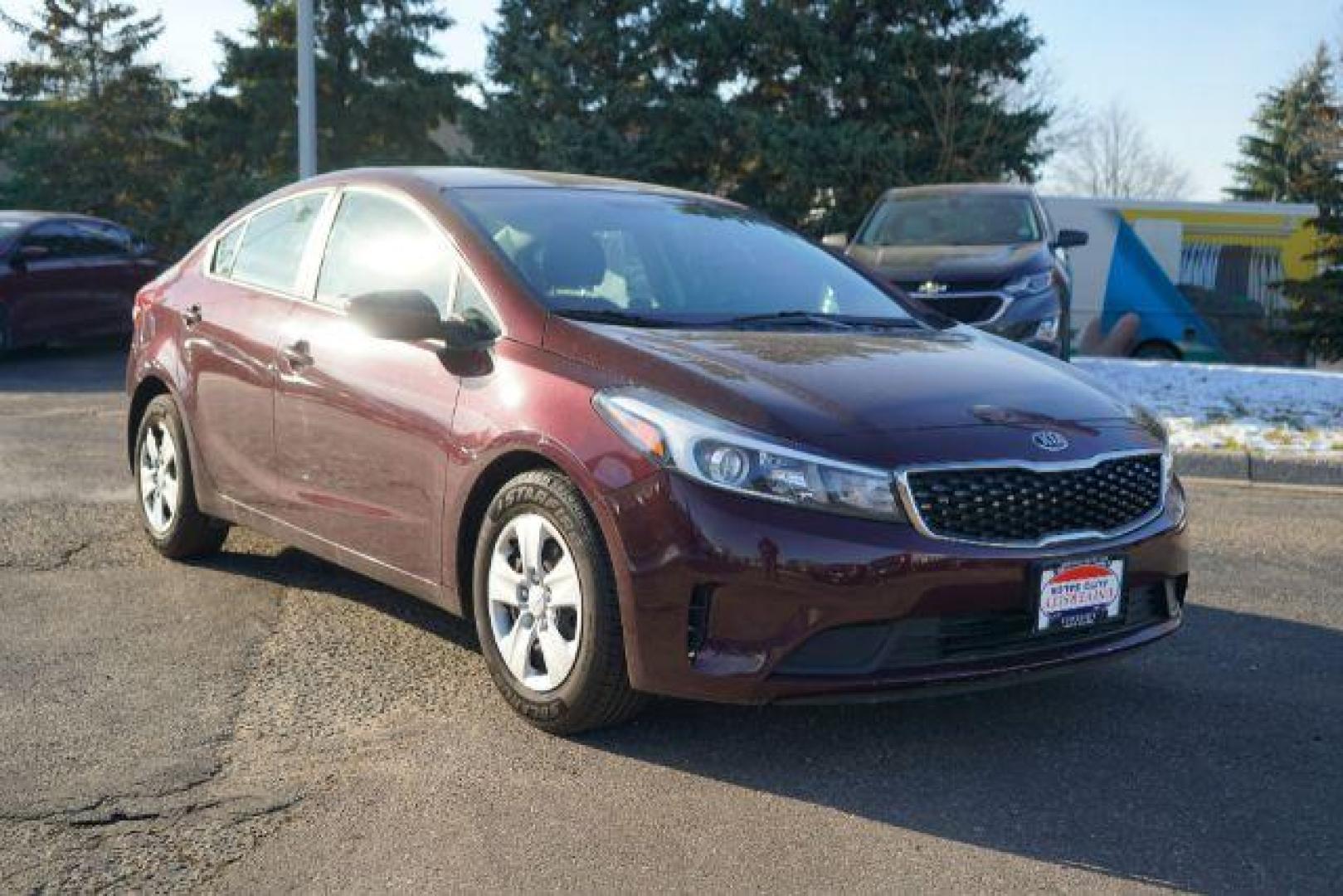 2017 Garnet Red Kia Forte LX 6M (3KPFK4A75HE) with an 2.0L L4 DOHC 16V engine, located at 3301 W Hwy 13, Burnsville, MN, 55337, (952) 460-3200, 44.775333, -93.320808 - Photo#0