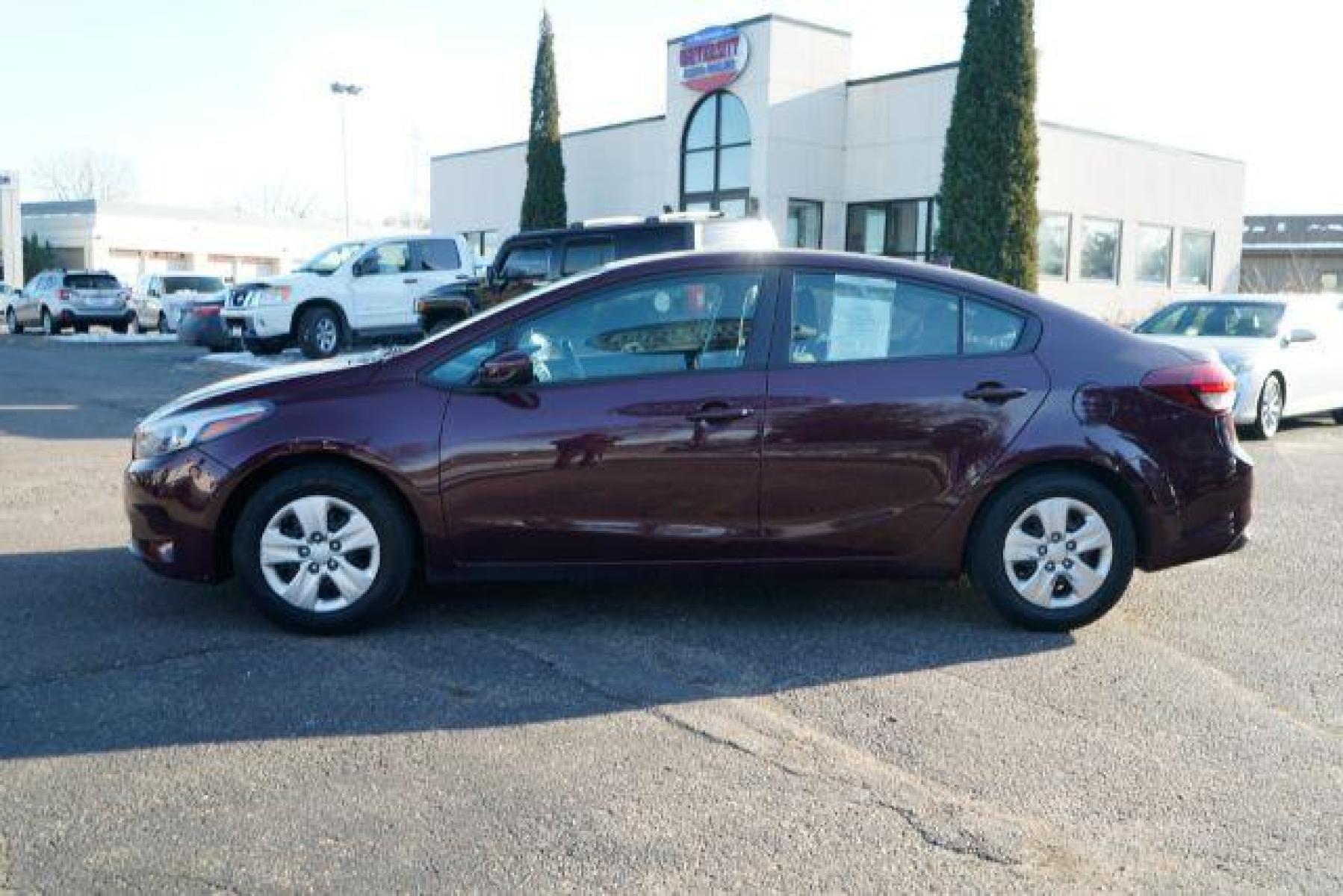 2017 Garnet Red Kia Forte LX 6M (3KPFK4A75HE) with an 2.0L L4 DOHC 16V engine, 6-Speed Manual transmission, located at 745 S Robert St, St. Paul, MN, 55107, (651) 222-2991, 44.923389, -93.081215 - Photo #3