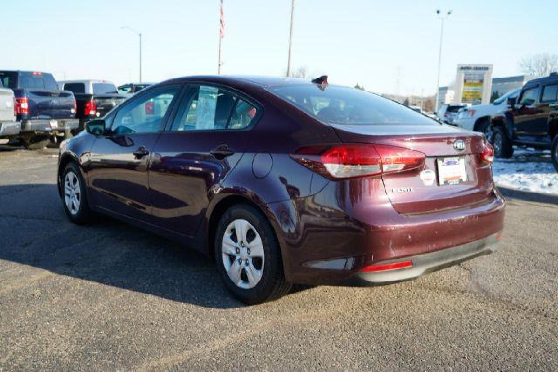 2017 Garnet Red Kia Forte LX 6M (3KPFK4A75HE) with an 2.0L L4 DOHC 16V engine, 6-Speed Manual transmission, located at 745 S Robert St, St. Paul, MN, 55107, (651) 222-2991, 44.923389, -93.081215 - Photo #4