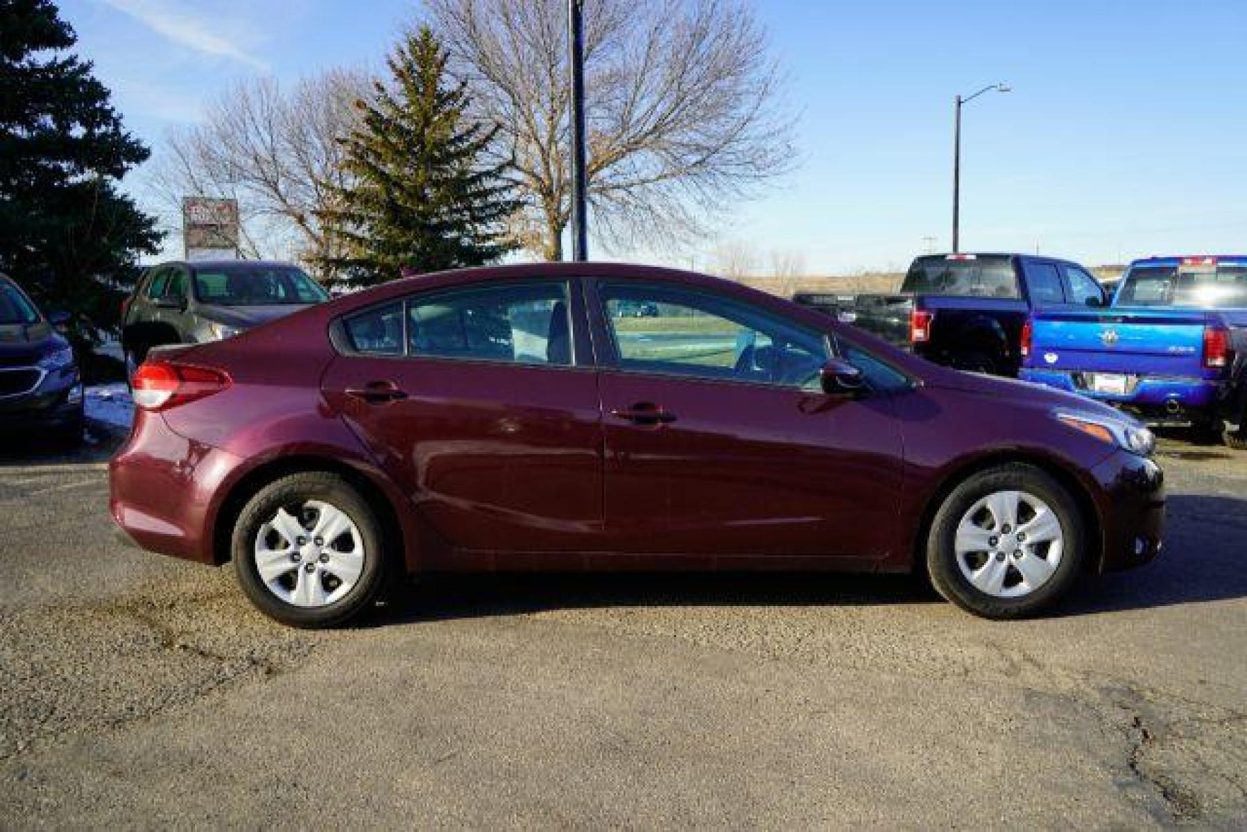 2017 Garnet Red Kia Forte LX 6M (3KPFK4A75HE) with an 2.0L L4 DOHC 16V engine, 6-Speed Manual transmission, located at 745 S Robert St, St. Paul, MN, 55107, (651) 222-2991, 44.923389, -93.081215 - Photo #7