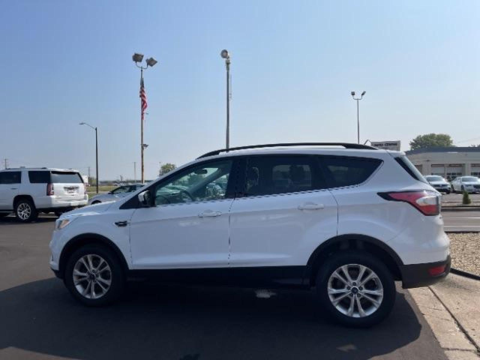 2018 Oxford White Ford Escape SE 4WD (1FMCU9GD7JU) with an 1.5L L4 DOHC 16V engine, 6-Speed Automatic transmission, located at 3301 W Hwy 13, Burnsville, MN, 55337, (952) 460-3200, 44.775333, -93.320808 - Photo #2