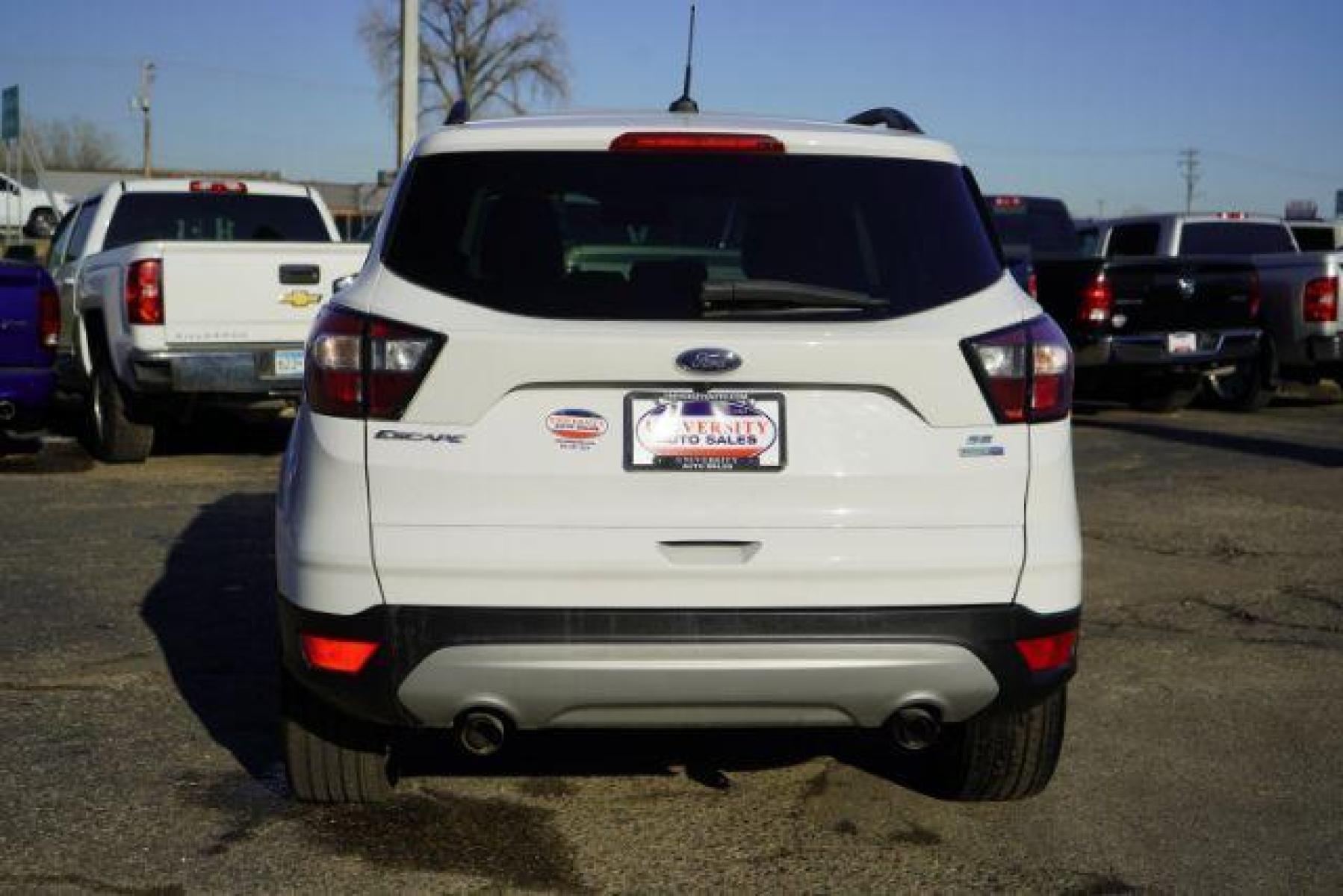 2018 Oxford White Ford Escape SE 4WD (1FMCU9GD7JU) with an 1.5L L4 DOHC 16V engine, 6-Speed Automatic transmission, located at 3301 W Hwy 13, Burnsville, MN, 55337, (952) 460-3200, 44.775333, -93.320808 - Photo #4