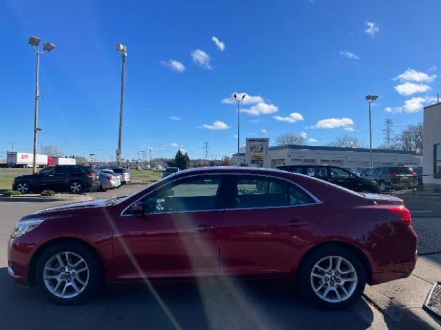 2013 Crystal Red Tintcoat Chevrolet Malibu ECO 2SA (1G11F5RR5DF) with an 2.4L L4 DOHC 16V engine, 6-Speed Automatic transmission, located at 745 S Robert St, St. Paul, MN, 55107, (651) 222-2991, 44.923389, -93.081215 - Photo#5