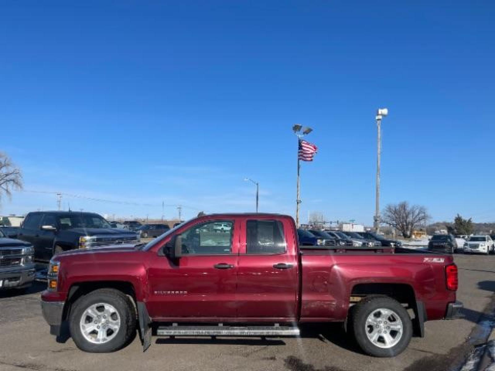 2014 Victory Red Chevrolet Silverado 1500 1LT Double Cab 4WD (1GCVKREC1EZ) with an 5.3L V8 OHV 16V engine, 6-Speed Automatic transmission, located at 3301 W Hwy 13, Burnsville, MN, 55337, (952) 460-3200, 44.775333, -93.320808 - Photo #1