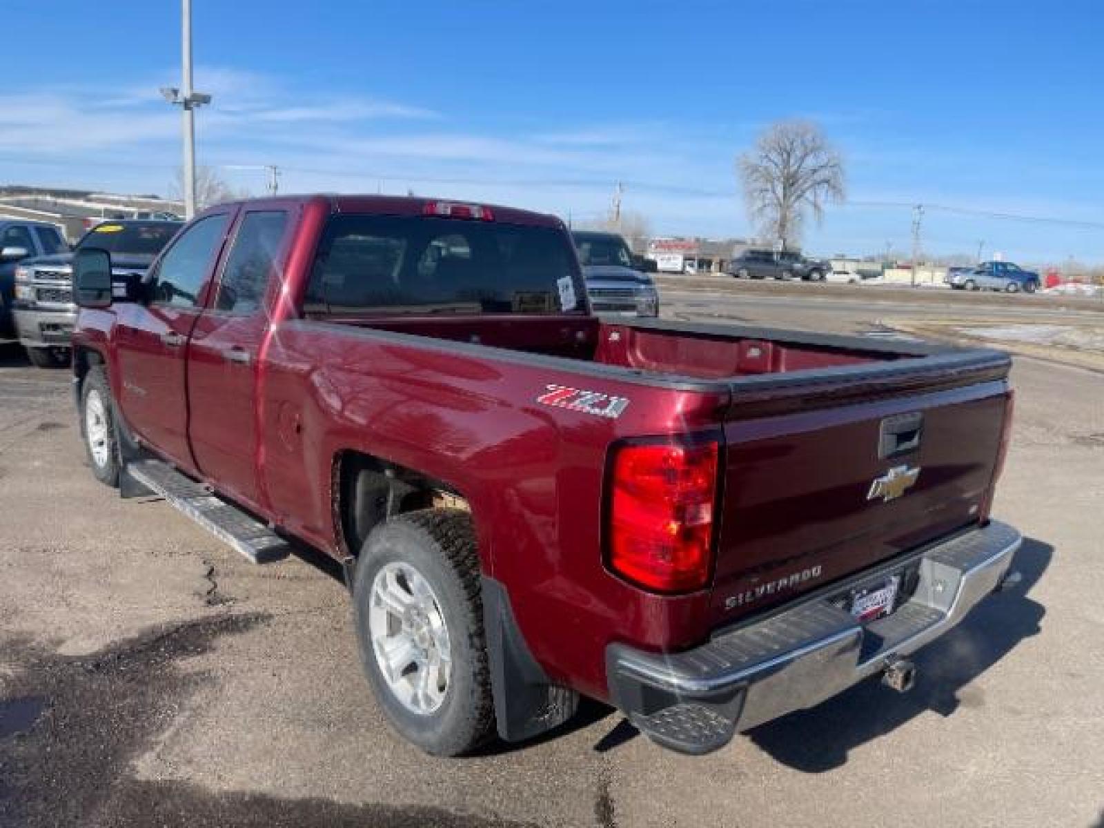2014 Victory Red Chevrolet Silverado 1500 1LT Double Cab 4WD (1GCVKREC1EZ) with an 5.3L V8 OHV 16V engine, 6-Speed Automatic transmission, located at 3301 W Hwy 13, Burnsville, MN, 55337, (952) 460-3200, 44.775333, -93.320808 - Photo #2