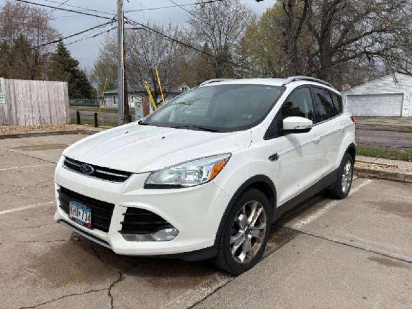 2014 White Platinum Trico Ford Escape Titanium FWD (1FMCU0J96EU) with an 2.0L L4 DOHC 16V engine, 6-Speed Automatic transmission, located at 745 S Robert St, St. Paul, MN, 55107, (651) 222-2991, 44.923389, -93.081215 - Photo#1