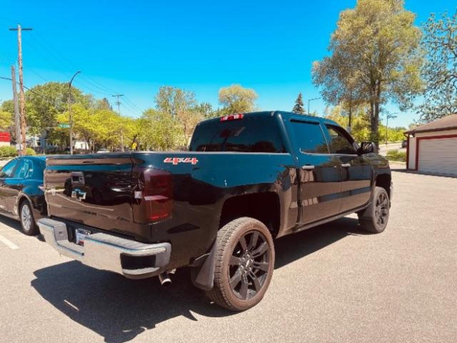 2014 Black Chevrolet Silverado 1500 1LT Crew Cab 4WD (3GCUKREC6EG) with an 5.3L V8 OHV 16V engine, 6-Speed Automatic transmission, located at 745 S Robert St, St. Paul, MN, 55107, (651) 222-2991, 44.923389, -93.081215 - Photo #3