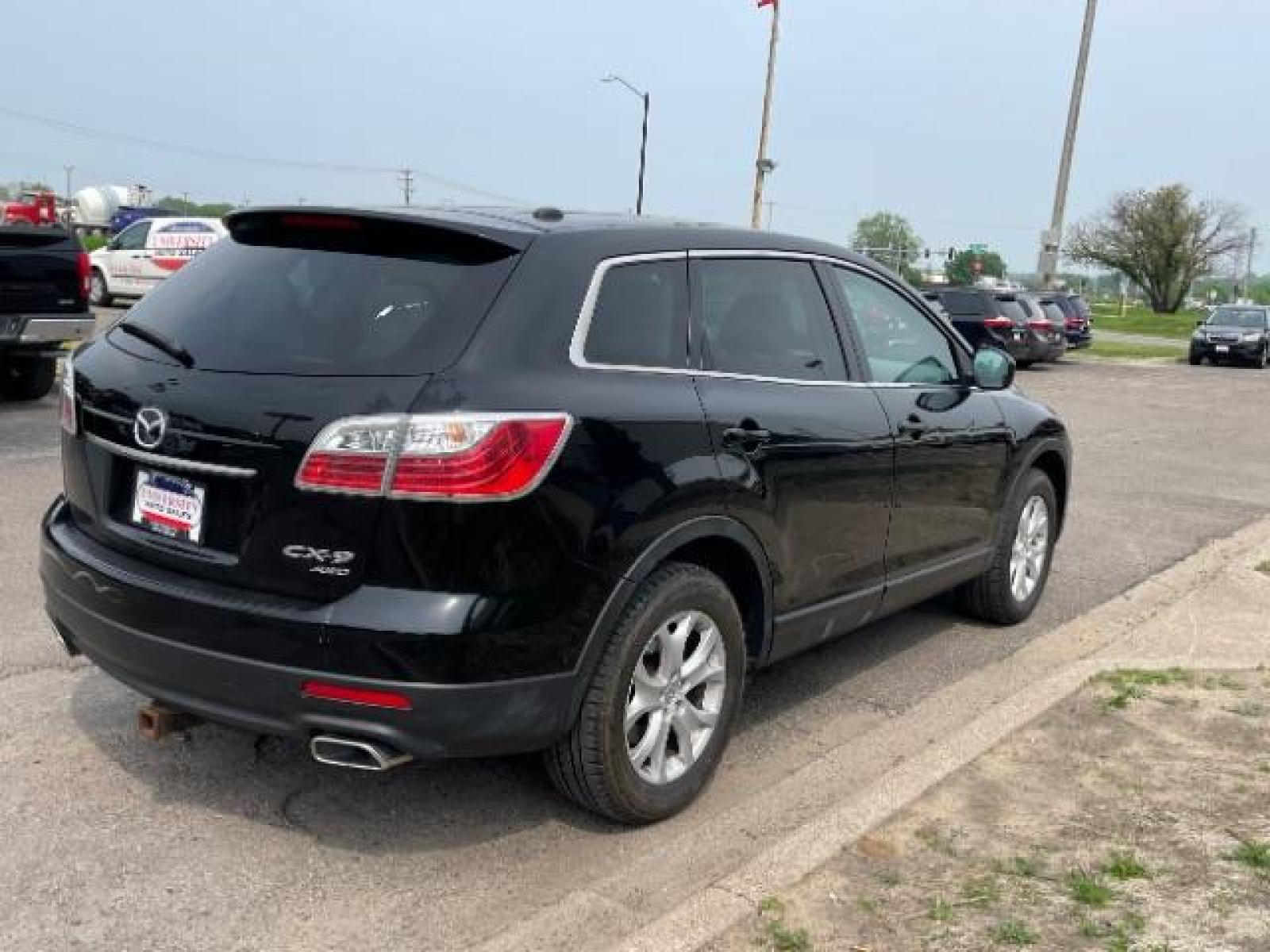 2012 Brilliant Black Clearcoat Mazda CX-9 Touring AWD (JM3TB3CA9C0) with an 3.7L V6 DOHC 24V engine, 6-Speed Automatic transmission, located at 745 S Robert St, St. Paul, MN, 55107, (651) 222-2991, 44.923389, -93.081215 - Photo #2