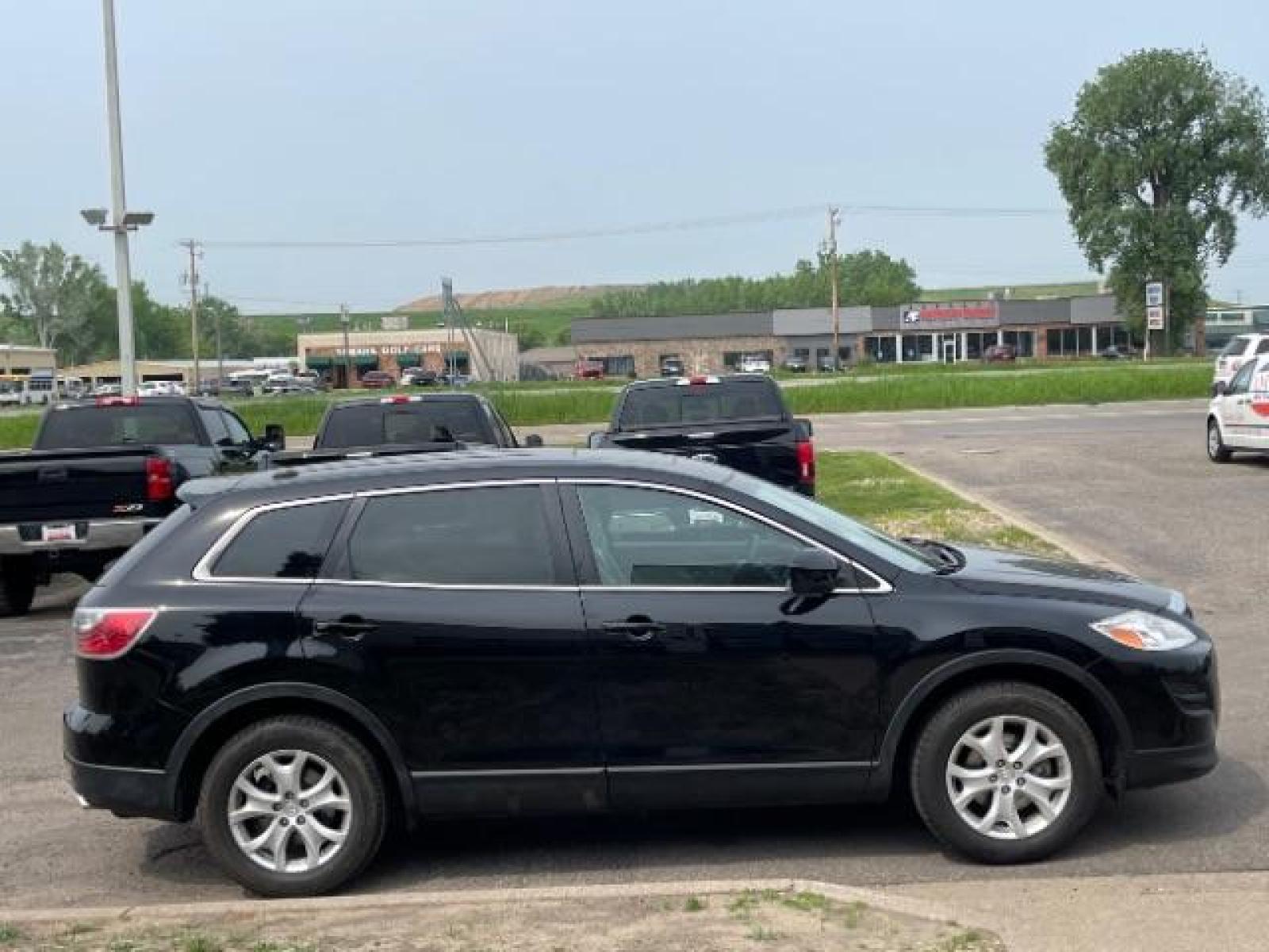 2012 Brilliant Black Clearcoat Mazda CX-9 Touring AWD (JM3TB3CA9C0) with an 3.7L V6 DOHC 24V engine, 6-Speed Automatic transmission, located at 745 S Robert St, St. Paul, MN, 55107, (651) 222-2991, 44.923389, -93.081215 - Photo #5