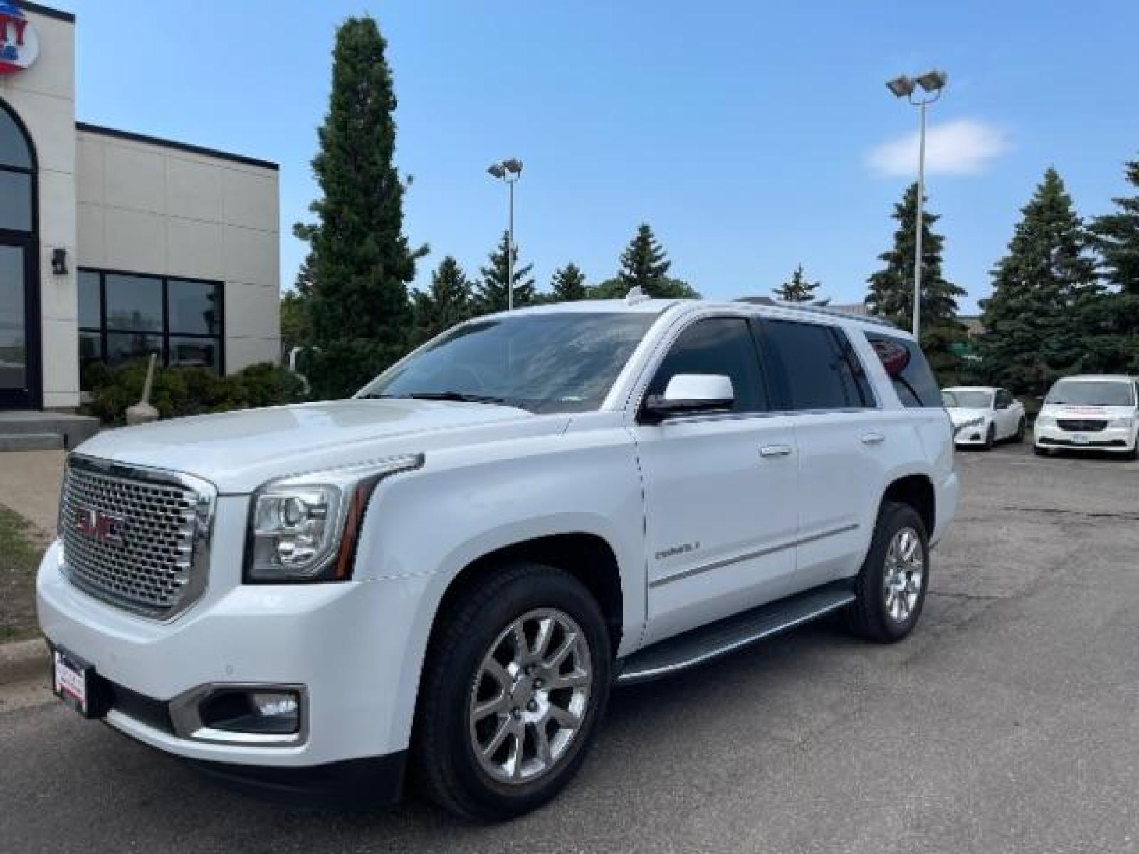 2016 Summit White GMC Yukon Denali 4WD (1GKS2CKJ7GR) with an 6.2L V8 OHV 16V engine, 6-Speed Automatic transmission, located at 745 S Robert St, St. Paul, MN, 55107, (651) 222-2991, 44.923389, -93.081215 - Photo #1