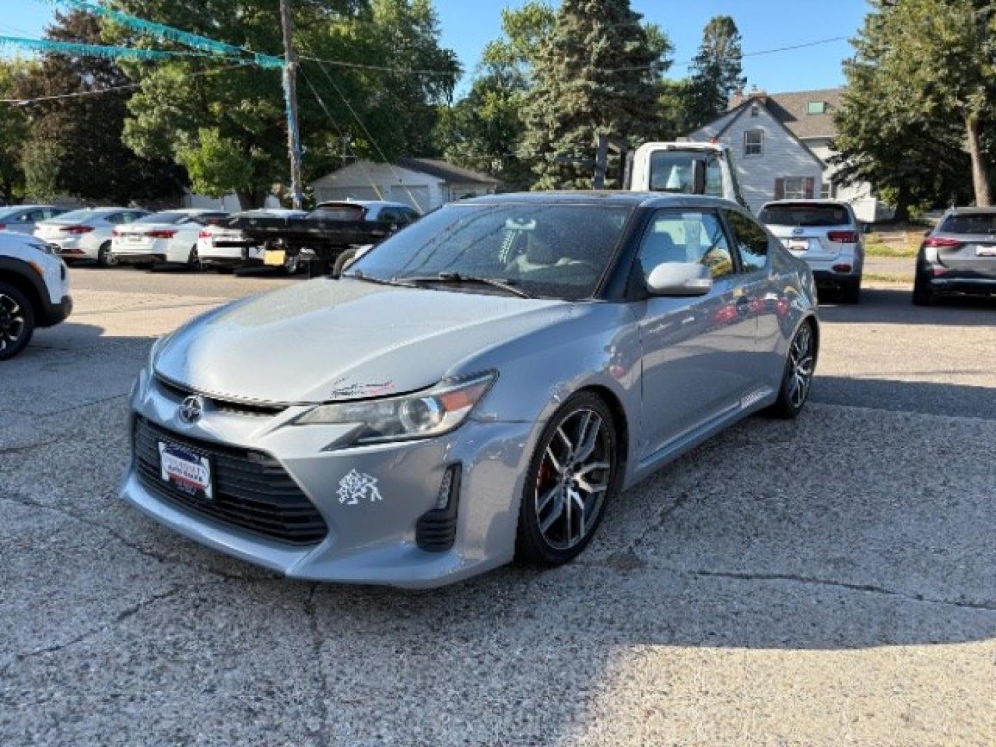 2014 Classic Silver Metal Scion tC Sports Coupe 6-Spd A (JTKJF5C78E3) with an 2.4L L4 DOHC 16V engine, 6-Speed Automatic transmission, located at 745 S Robert St, St. Paul, MN, 55107, (651) 222-2991, 44.923389, -93.081215- Photo#2