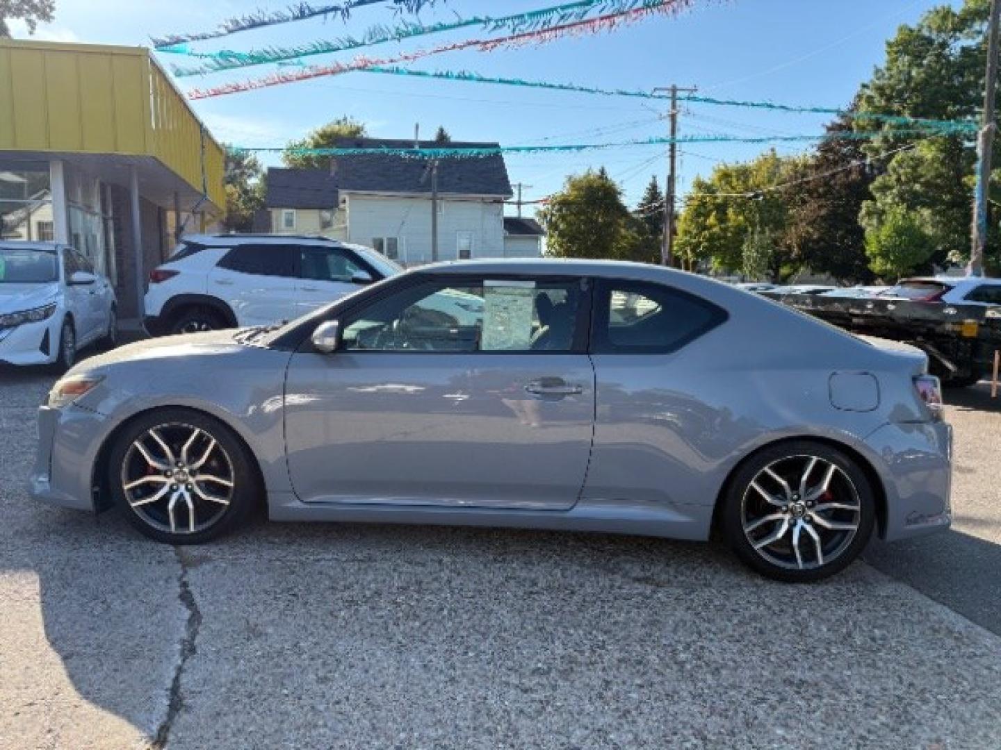 2014 Classic Silver Metal Scion tC Sports Coupe 6-Spd A (JTKJF5C78E3) with an 2.4L L4 DOHC 16V engine, 6-Speed Automatic transmission, located at 745 S Robert St, St. Paul, MN, 55107, (651) 222-2991, 44.923389, -93.081215- Photo#3