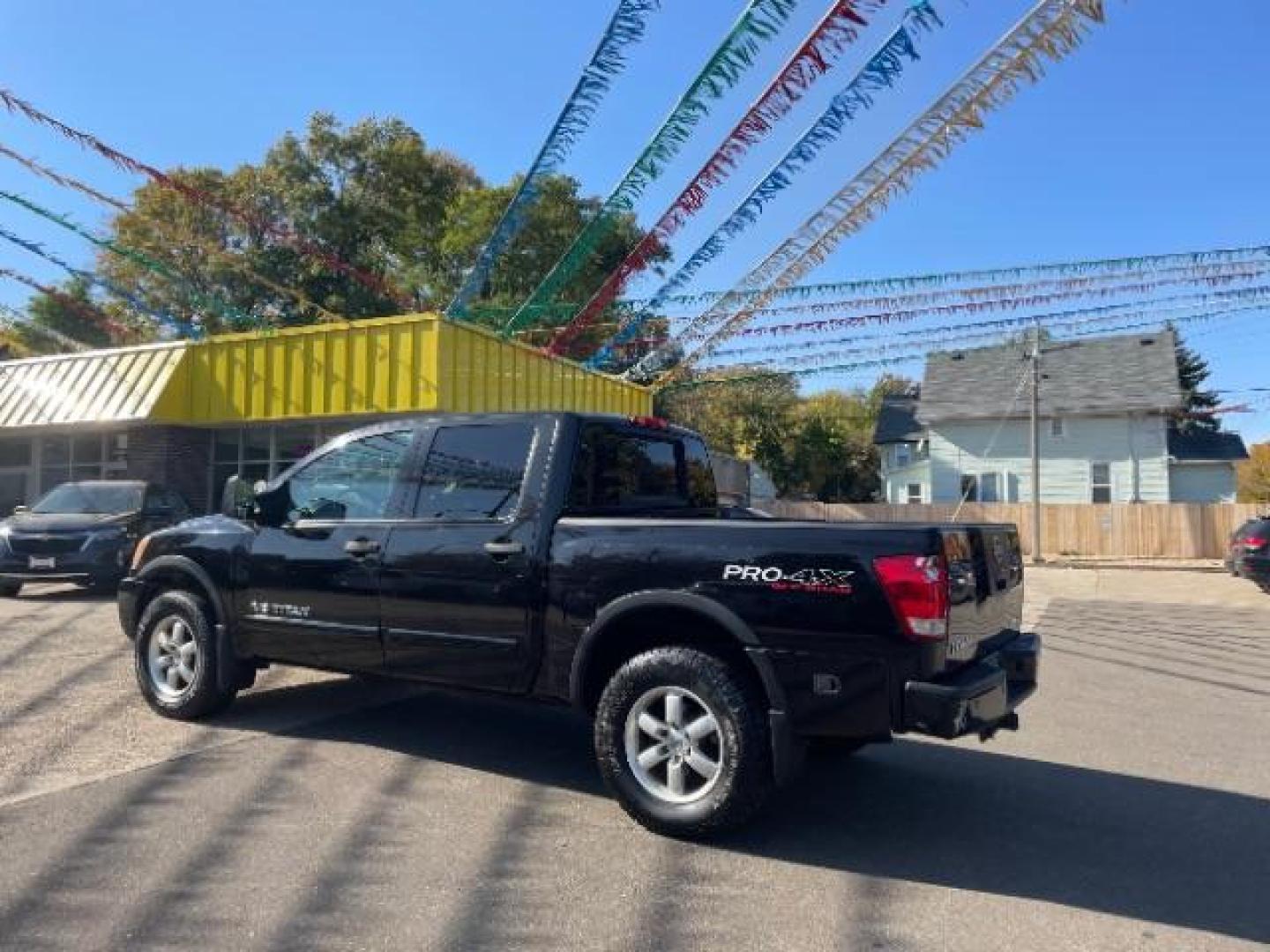 2012 Galaxy Black Metalli Nissan Titan PRO-4X Crew Cab 4WD (1N6AA0EC2CN) with an 5.6L V8 DOHC 32V engine, 5-Speed Automatic transmission, located at 745 S Robert St, St. Paul, MN, 55107, (651) 222-2991, 44.923389, -93.081215 - Photo#1