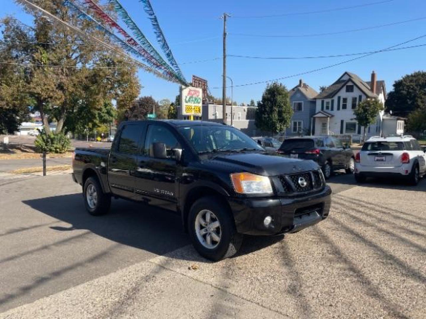 2012 Galaxy Black Metalli Nissan Titan PRO-4X Crew Cab 4WD (1N6AA0EC2CN) with an 5.6L V8 DOHC 32V engine, 5-Speed Automatic transmission, located at 745 S Robert St, St. Paul, MN, 55107, (651) 222-2991, 44.923389, -93.081215 - Photo#3