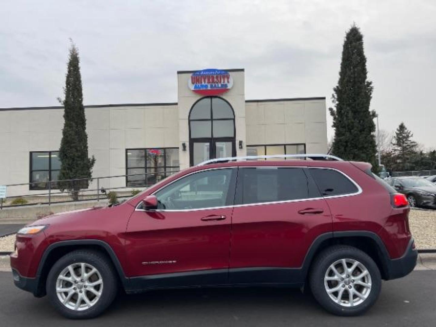 2016 Deep Cherry Red Crystal Pearl Coat Jeep Cherokee Latitude FWD (1C4PJLCB1GW) with an 2.4L L4 DOHC 16V engine, 9-Speed Automatic transmission, located at 3301 W Hwy 13, Burnsville, MN, 55337, (952) 460-3200, 44.775333, -93.320808 - Photo#2