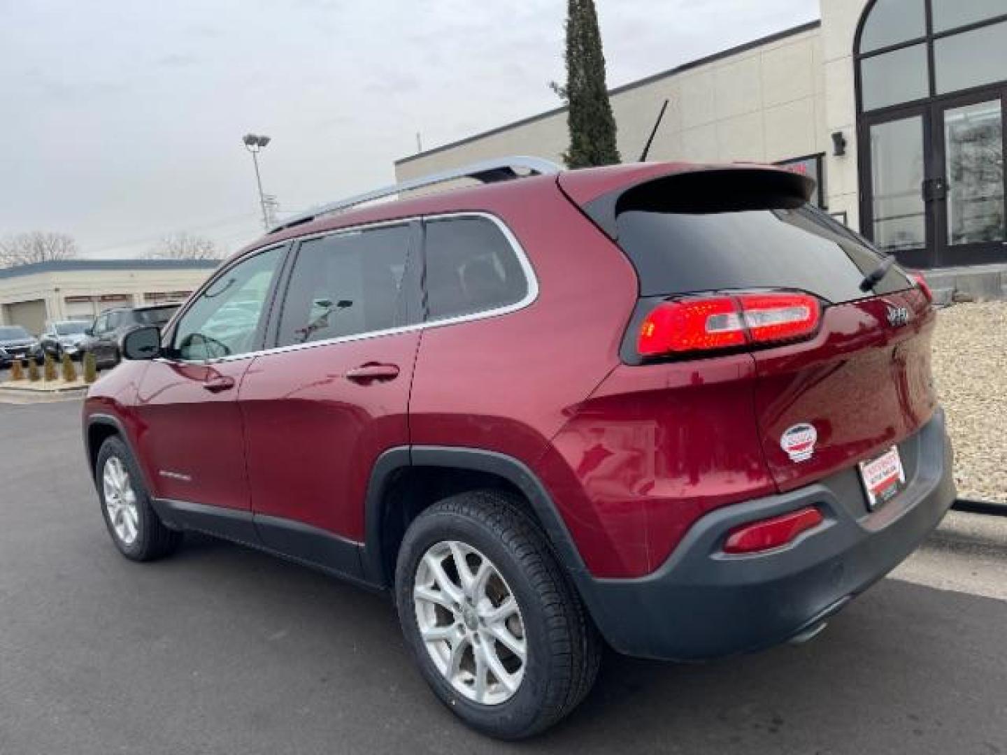 2016 Deep Cherry Red Crystal Pearl Coat Jeep Cherokee Latitude FWD (1C4PJLCB1GW) with an 2.4L L4 DOHC 16V engine, 9-Speed Automatic transmission, located at 3301 W Hwy 13, Burnsville, MN, 55337, (952) 460-3200, 44.775333, -93.320808 - Photo#3