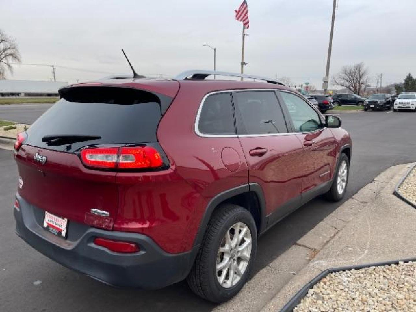 2016 Deep Cherry Red Crystal Pearl Coat Jeep Cherokee Latitude FWD (1C4PJLCB1GW) with an 2.4L L4 DOHC 16V engine, 9-Speed Automatic transmission, located at 3301 W Hwy 13, Burnsville, MN, 55337, (952) 460-3200, 44.775333, -93.320808 - Photo#5