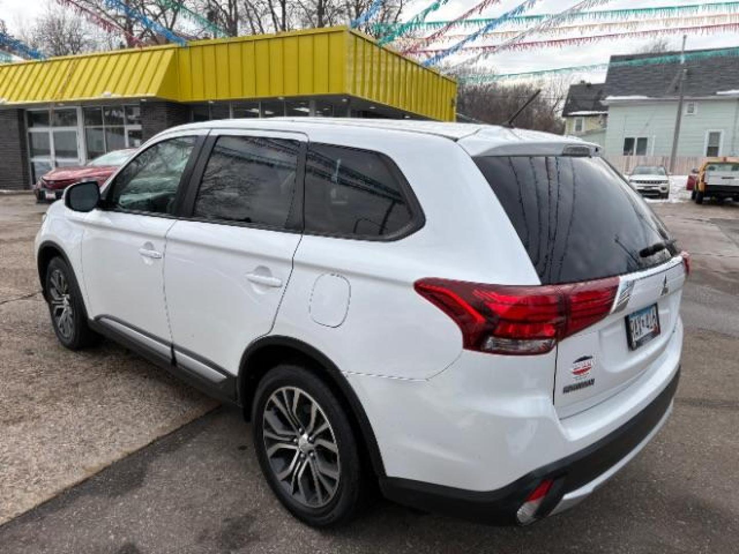 2016 Diamond White Mitsubishi Outlander SE AWD (JA4AZ3A32GZ) with an 2.4L L4 DOHC 16V engine, Continuously Variabl transmission, located at 745 S Robert St, St. Paul, MN, 55107, (651) 222-2991, 44.923389, -93.081215 - Photo#2