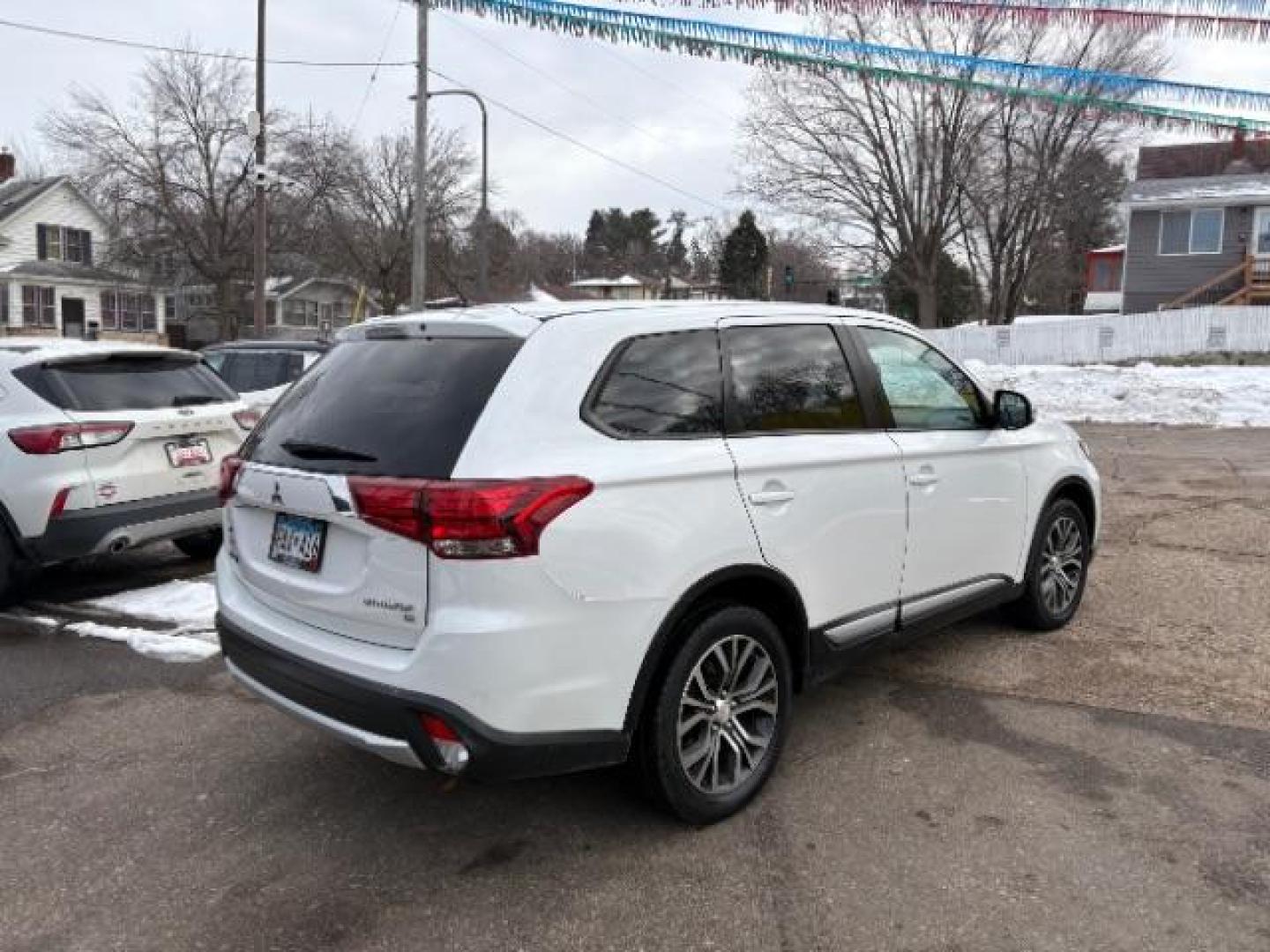 2016 Diamond White Mitsubishi Outlander SE AWD (JA4AZ3A32GZ) with an 2.4L L4 DOHC 16V engine, Continuously Variabl transmission, located at 745 S Robert St, St. Paul, MN, 55107, (651) 222-2991, 44.923389, -93.081215 - Photo#3