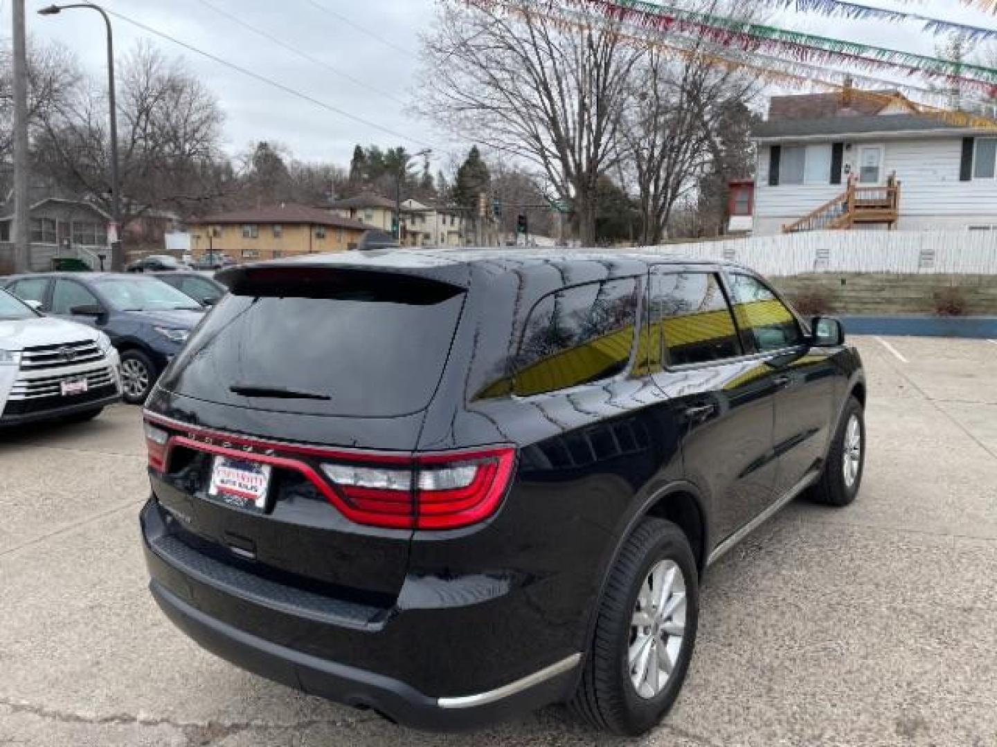 2021 Diamond Black Clear Coat Dodge Durango SXT AWD (1C4RDJAG5MC) with an 3.6L V6 DOHC 24V engine, 8-Speed Automatic transmission, located at 745 S Robert St, St. Paul, MN, 55107, (651) 222-2991, 44.923389, -93.081215 - Photo#4