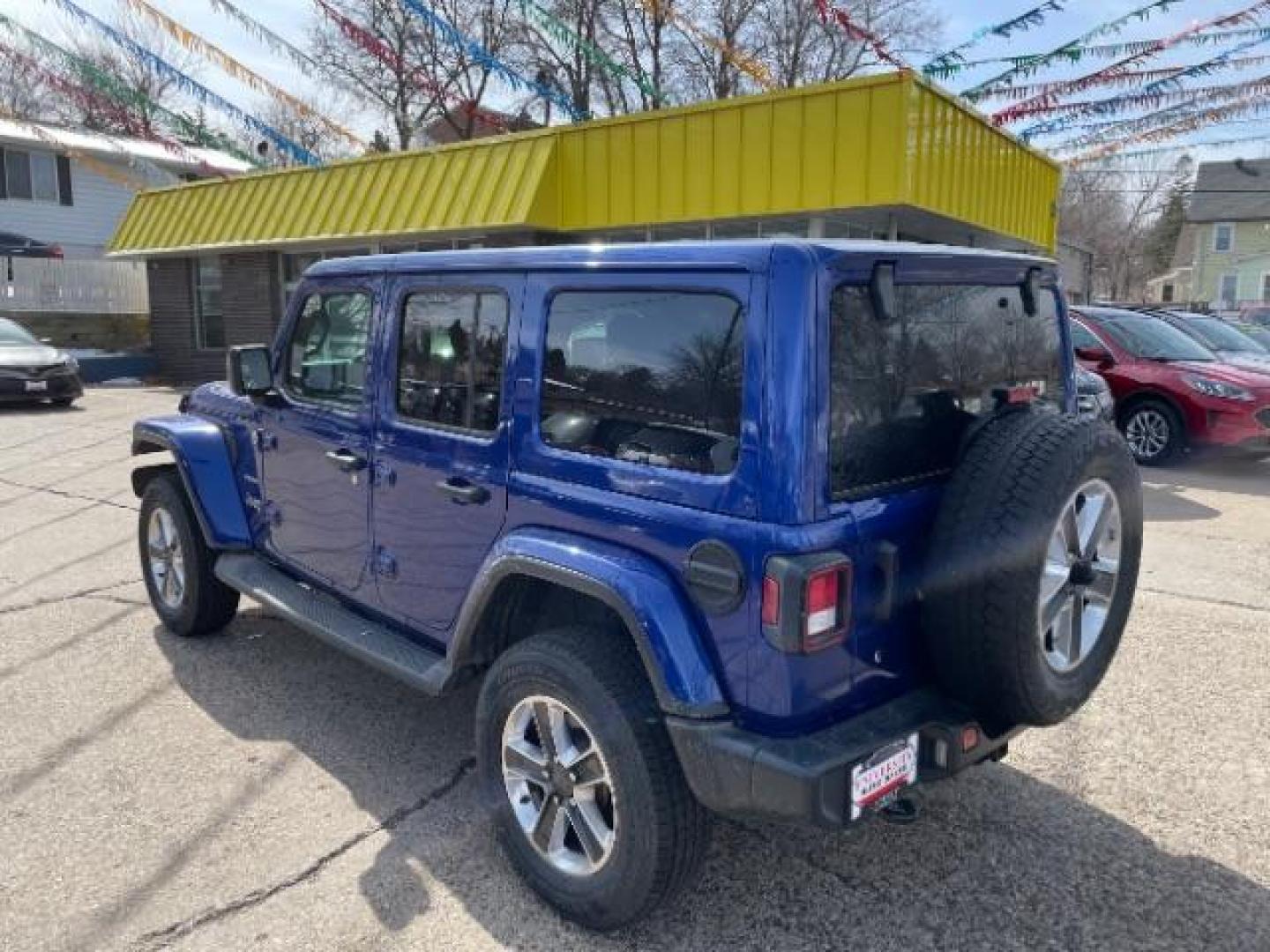 2019 BLUE Jeep Wrangler Unlimited Sahara (1C4HJXEGXKW) with an 3.6L V6 DOHC 24V FFV engine, 6-Speed Manual transmission, located at 745 S Robert St, St. Paul, MN, 55107, (651) 222-2991, 44.923389, -93.081215 - Photo#2