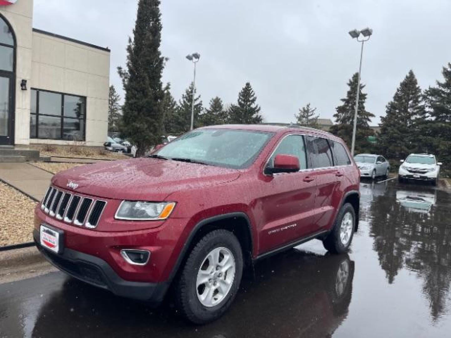 2015 Dp Cherry Red Crystal PC Jeep Grand Cherokee Laredo 4WD (1C4RJFAG2FC) with an 3.6L V6 DOHC 24V engine, 8-Speed Automatic transmission, located at 3301 W Hwy 13, Burnsville, MN, 55337, (952) 460-3200, 44.775333, -93.320808 - Photo#1