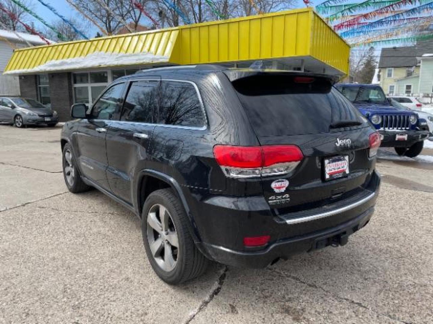 2016 Brilliant Black Crystal Pearl Coat Jeep Grand Cherokee Overland 4WD (1C4RJFCMXGC) with an 3.0L V6 DOHC 24V DIESEL engine, 8-Speed Automatic transmission, located at 3301 W Hwy 13, Burnsville, MN, 55337, (952) 460-3200, 44.775333, -93.320808 - Photo#2