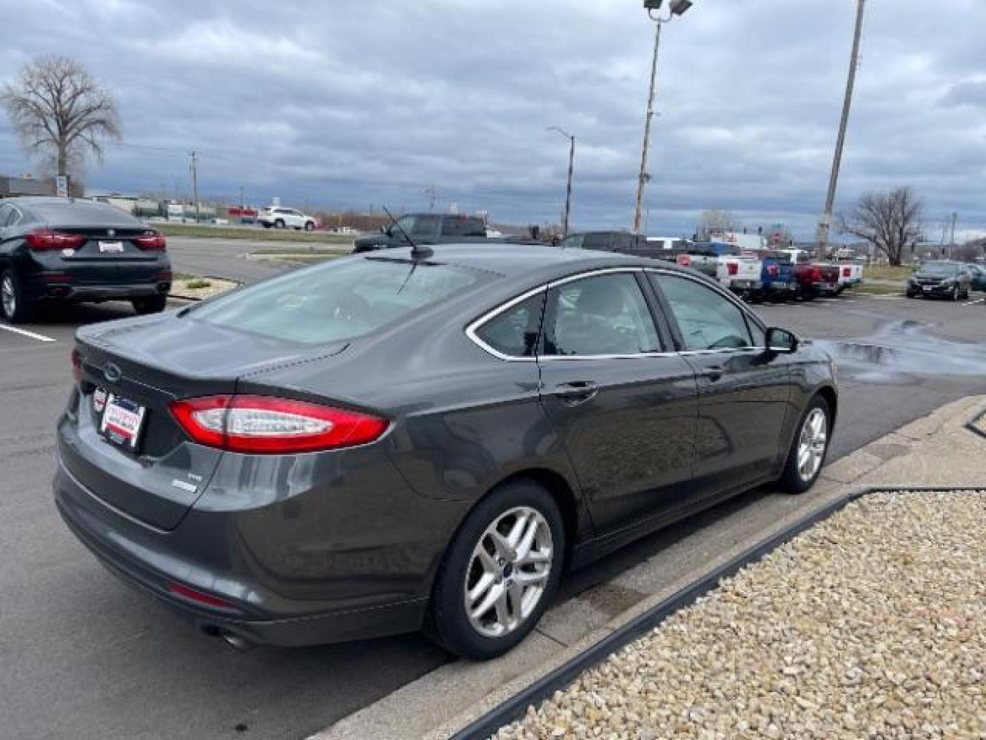 2015 GRAY Ford Fusion SE (3FA6P0HD4FR) with an 1.5L L4 DOHC 16V engine, 6-Speed Automatic transmission, located at 3301 W Hwy 13, Burnsville, MN, 55337, (952) 460-3200, 44.775333, -93.320808 - Photo#2