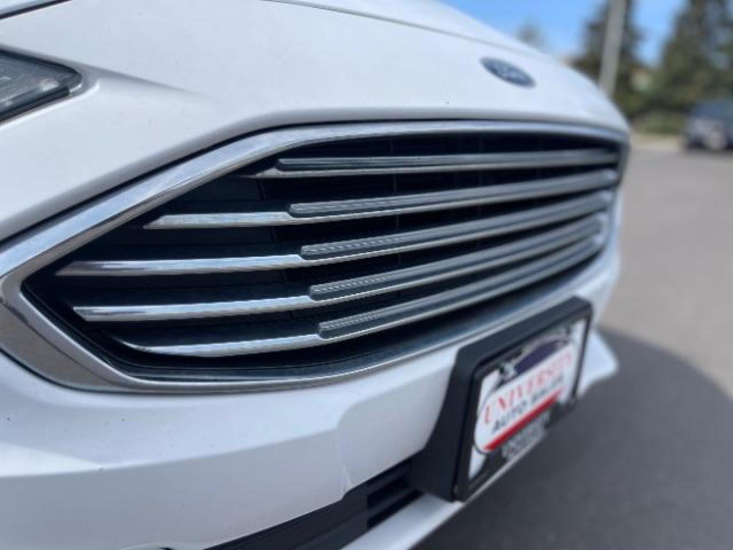 2017 Oxford White Clearcoat Ford Fusion SE (3FA6P0H78HR) with an 2.5L L4 DOHC 16V engine, 6-Speed Automatic transmission, located at 3301 W Hwy 13, Burnsville, MN, 55337, (952) 460-3200, 44.775333, -93.320808 - Photo#4