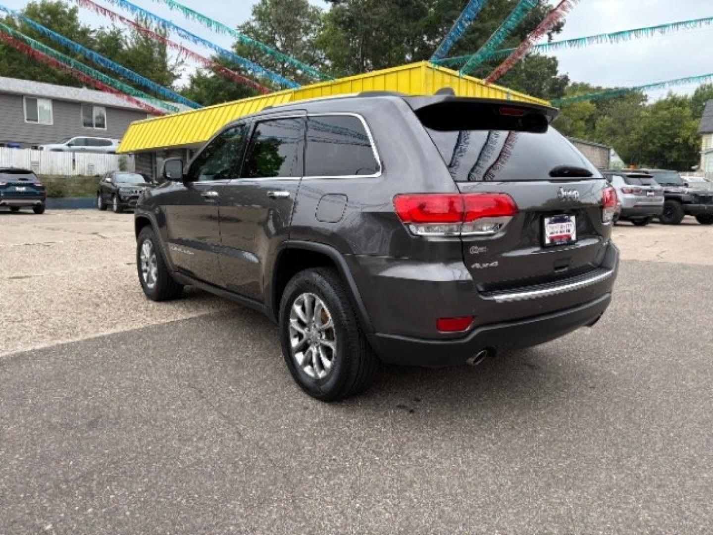 2014 Maximum Steel Metall Jeep Grand Cherokee Limited 4WD (1C4RJFBG0EC) with an 3.6L V6 DOHC 24V engine, 5-Speed Automatic transmission, located at 745 S Robert St, St. Paul, MN, 55107, (651) 222-2991, 44.923389, -93.081215- Photo#4