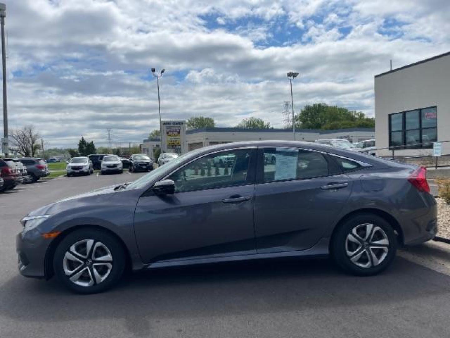 2016 GRAY Honda Civic LX Sedan 6MT (19XFC2E56GE) with an 2.0L L4 DOHC 16V engine, 6-Speed Manual transmission, located at 3301 W Hwy 13, Burnsville, MN, 55337, (952) 460-3200, 44.775333, -93.320808 - Photo#5