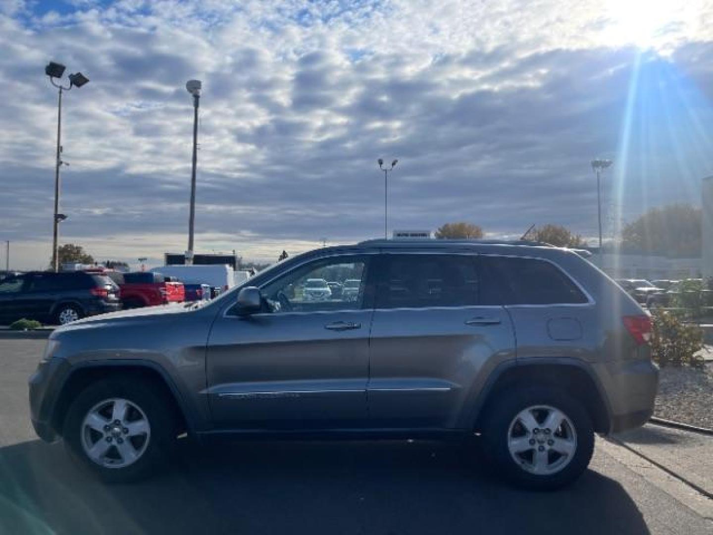 2012 Jeep Grand Cherokee Laredo 4WD (1C4RJFAGXCC) with an 3.6L V6 DOHC 24V engine, 5-Speed Automatic transmission, located at 3301 W Hwy 13, Burnsville, MN, 55337, (952) 460-3200, 44.775333, -93.320808 - Photo#3