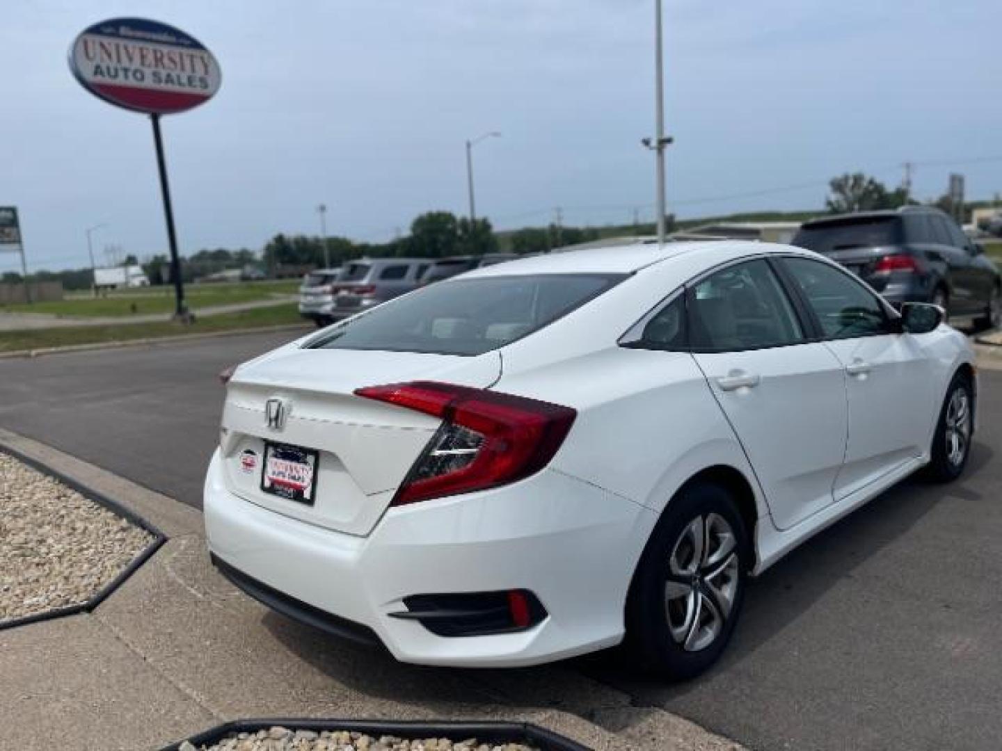 2016 Taffeta White Honda Civic LX Sedan CVT (19XFC2F58GE) with an 2.0L L4 DOHC 16V engine, Continuously Variable Transmission transmission, located at 745 S Robert St, St. Paul, MN, 55107, (651) 222-2991, 44.923389, -93.081215 - Photo#2