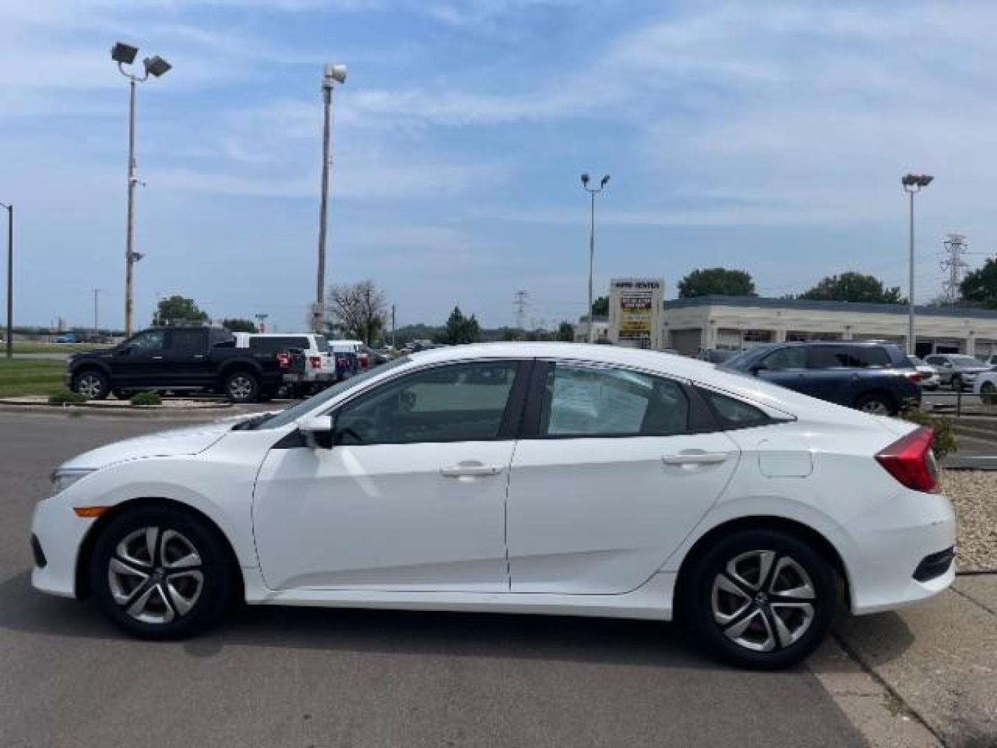 2016 Taffeta White Honda Civic LX Sedan CVT (19XFC2F58GE) with an 2.0L L4 DOHC 16V engine, Continuously Variable Transmission transmission, located at 745 S Robert St, St. Paul, MN, 55107, (651) 222-2991, 44.923389, -93.081215 - Photo#4