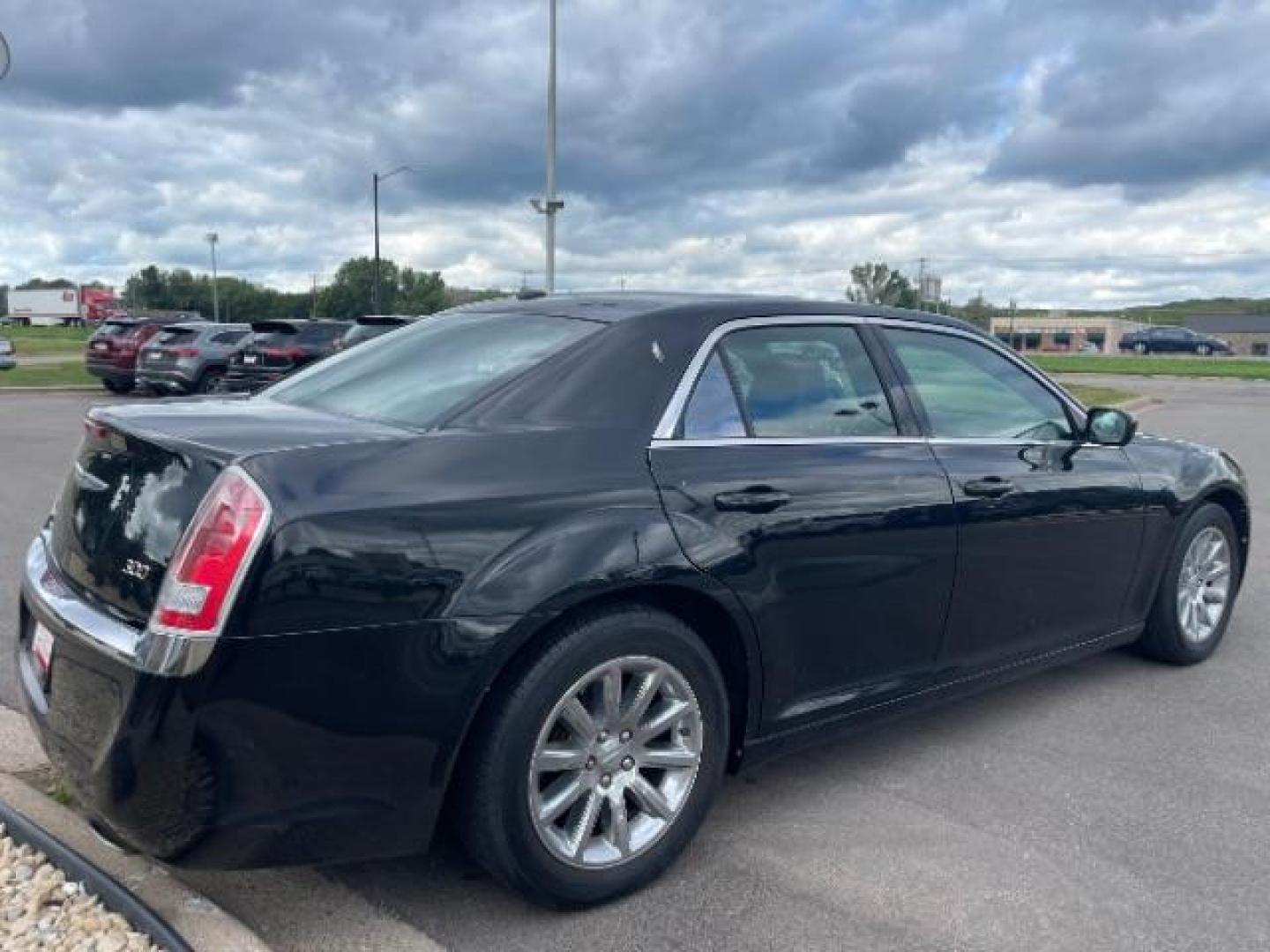 2014 Gloss Black Chrysler 300 RWD (2C3CCAAG2EH) with an 3.6L V6 SOHC 24V engine, 8-Speed Automatic transmission, located at 745 S Robert St, St. Paul, MN, 55107, (651) 222-2991, 44.923389, -93.081215 - Photo#3