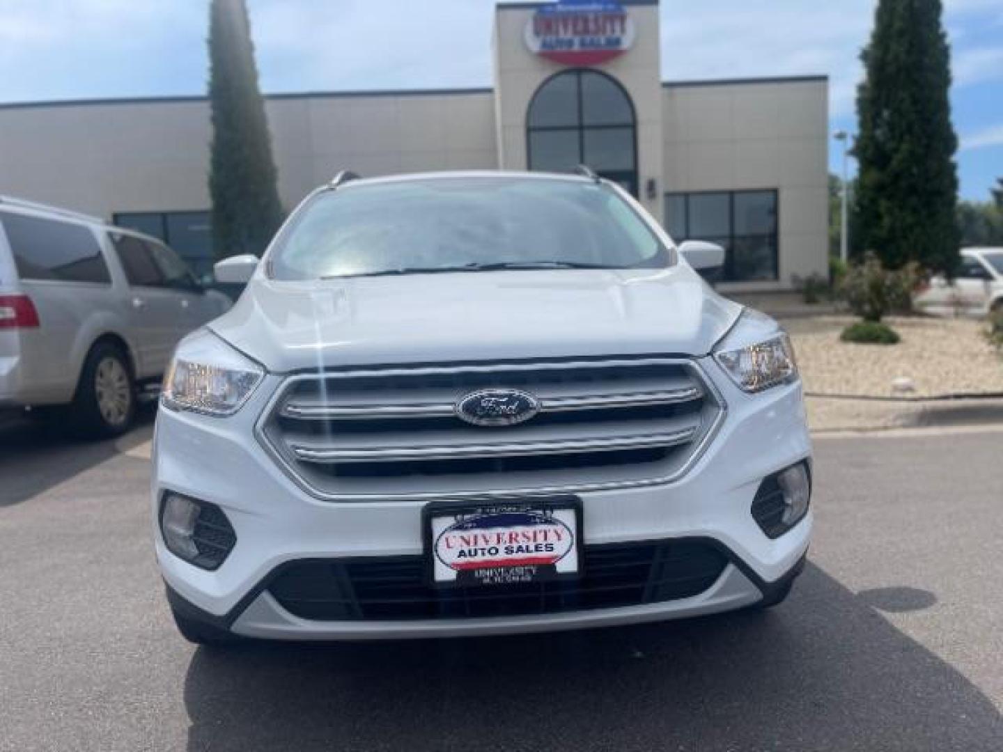 2018 Oxford White Ford Escape SE 4WD (1FMCU9G93JU) with an 2.0L L4 DOHC 16V engine, 6-Speed Automatic transmission, located at 3301 W Hwy 13, Burnsville, MN, 55337, (952) 460-3200, 44.775333, -93.320808 - Photo#1