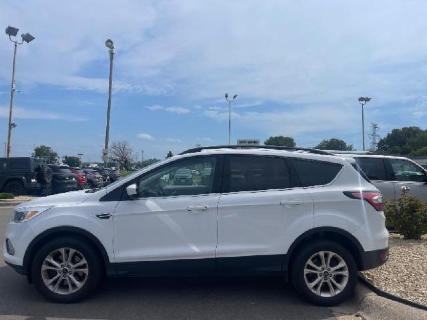 2018 Oxford White Ford Escape SE 4WD (1FMCU9G93JU) with an 2.0L L4 DOHC 16V engine, 6-Speed Automatic transmission, located at 3301 W Hwy 13, Burnsville, MN, 55337, (952) 460-3200, 44.775333, -93.320808 - Photo#3