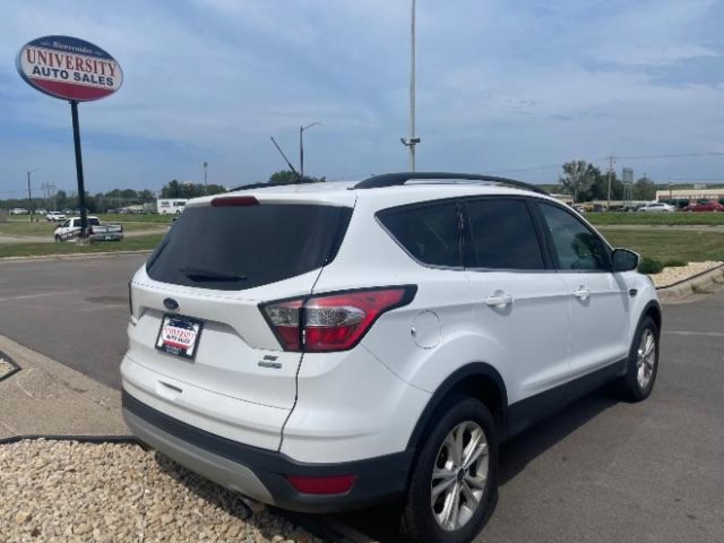 2018 Oxford White Ford Escape SE 4WD (1FMCU9G93JU) with an 2.0L L4 DOHC 16V engine, 6-Speed Automatic transmission, located at 3301 W Hwy 13, Burnsville, MN, 55337, (952) 460-3200, 44.775333, -93.320808 - Photo#5