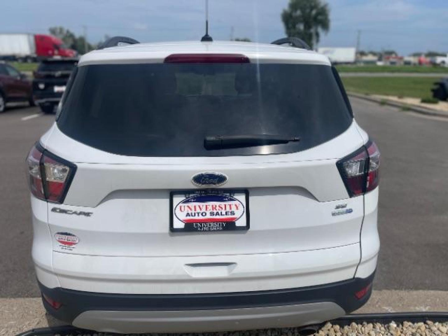 2018 Oxford White Ford Escape SE 4WD (1FMCU9G93JU) with an 2.0L L4 DOHC 16V engine, 6-Speed Automatic transmission, located at 3301 W Hwy 13, Burnsville, MN, 55337, (952) 460-3200, 44.775333, -93.320808 - Photo#6